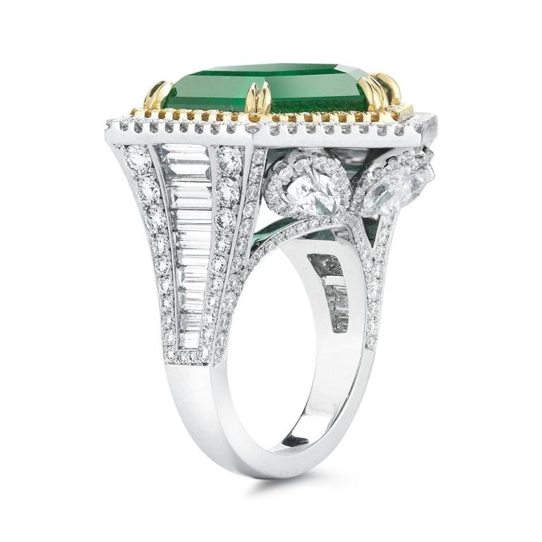 UNIQUE HEXAGONAL EMERALD RING A truly out of the ordinary and very rare hexagonal shaped Emerald is surrounded by a halo of Fancy Yellow and white diamonds creating a unique and striking presence for who ever wears this ring Item: # 02379 Metal: 18k