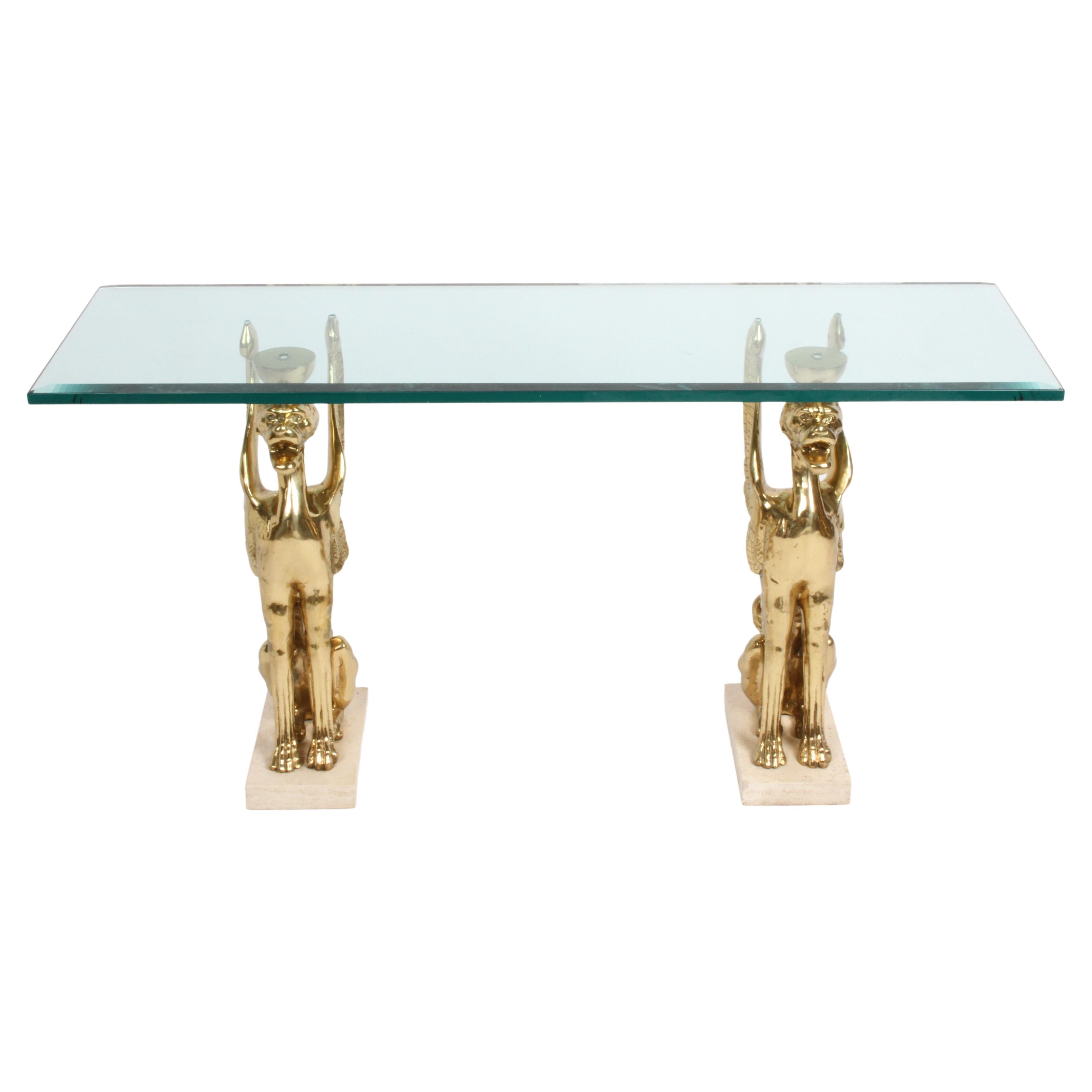 Unico tavolo da ingresso o consolle in vetro con grifoni in bronzo stilizzati Hollywood Regency