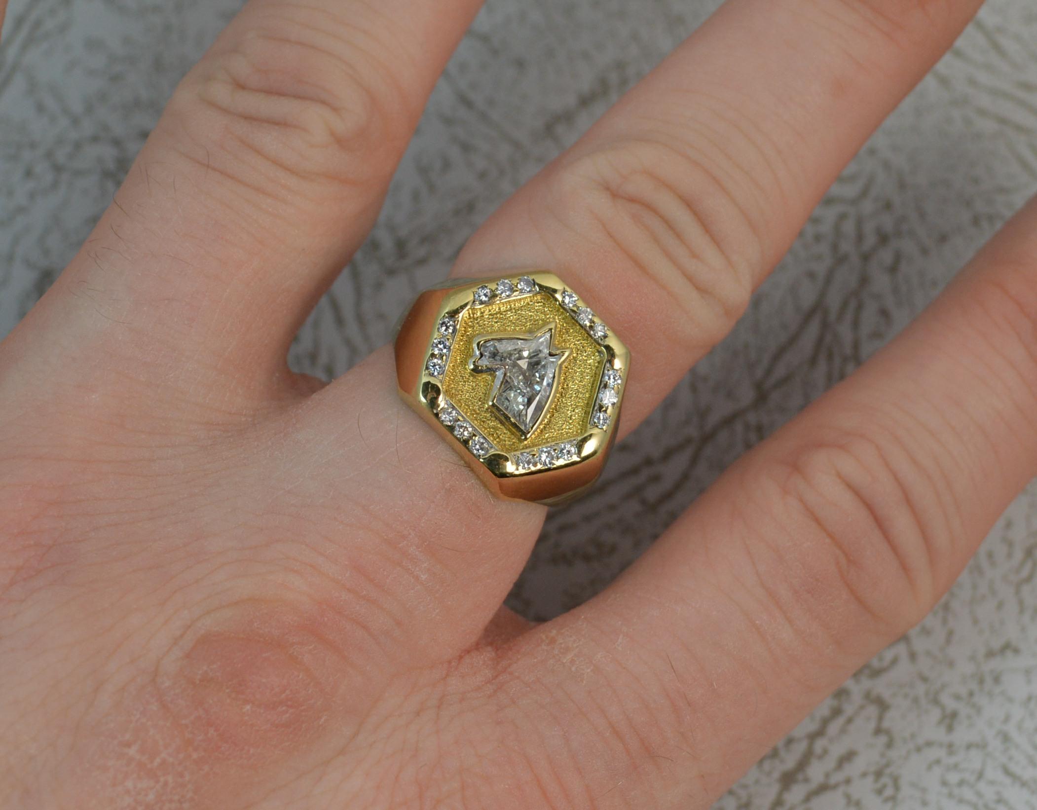 A very rare and unusual signet design ring.
SIZE ; N UK, 6 1/2 US
Modelled in 18 carat yellow gold throughout.
Designed with a hexagonal shaped head, 16mm x 14.5mm.
To the front is a horse head cut natural diamond. Truly expertly cut stone in bezel