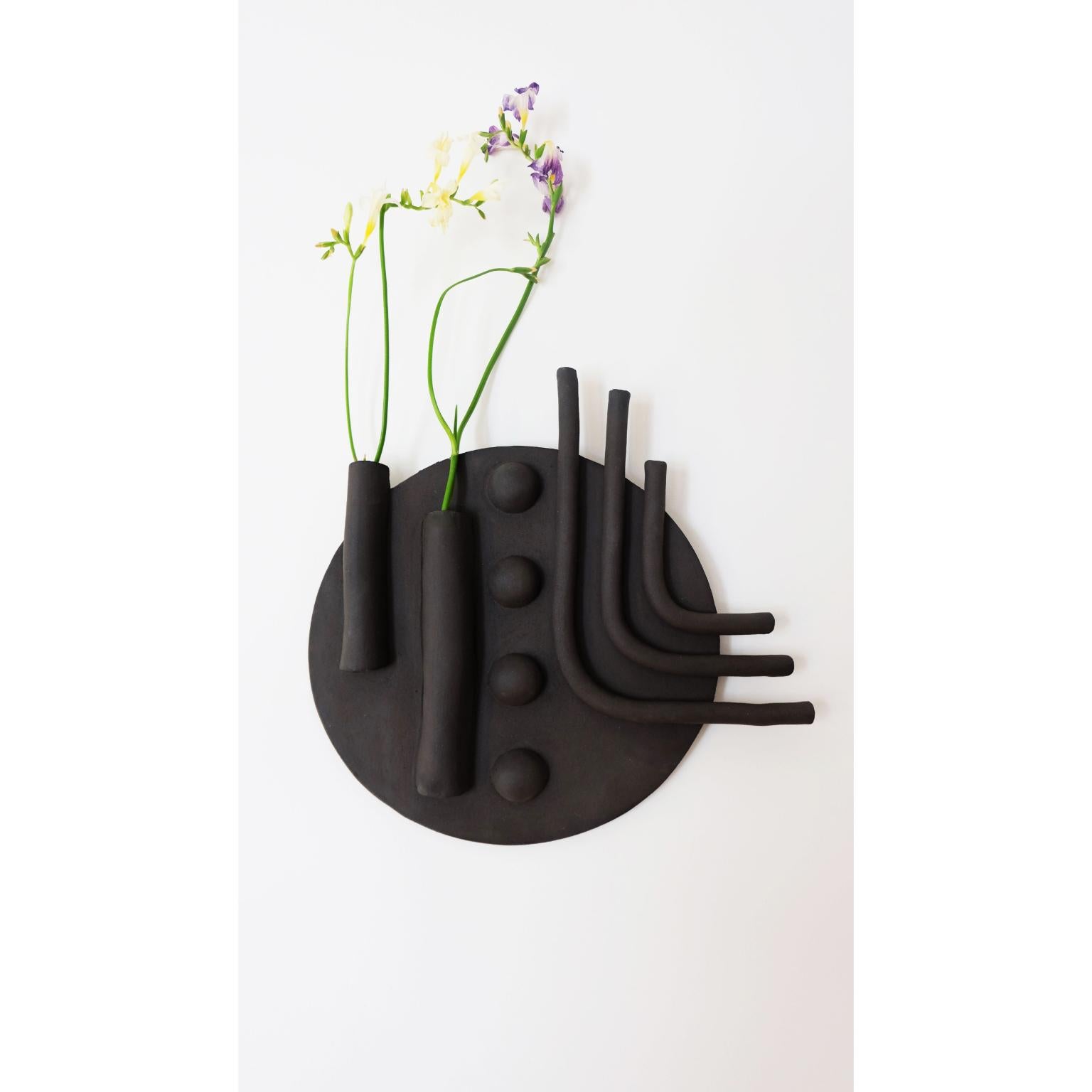 Unique vase and wall sculpt by Ia Kutateladze
Dimensions: D 28 
Materials: Clay

A bold, sculpture for the wall that could also be used as a vase. Strong geometrical shapes brought together to create a unique decorative piece for any type of