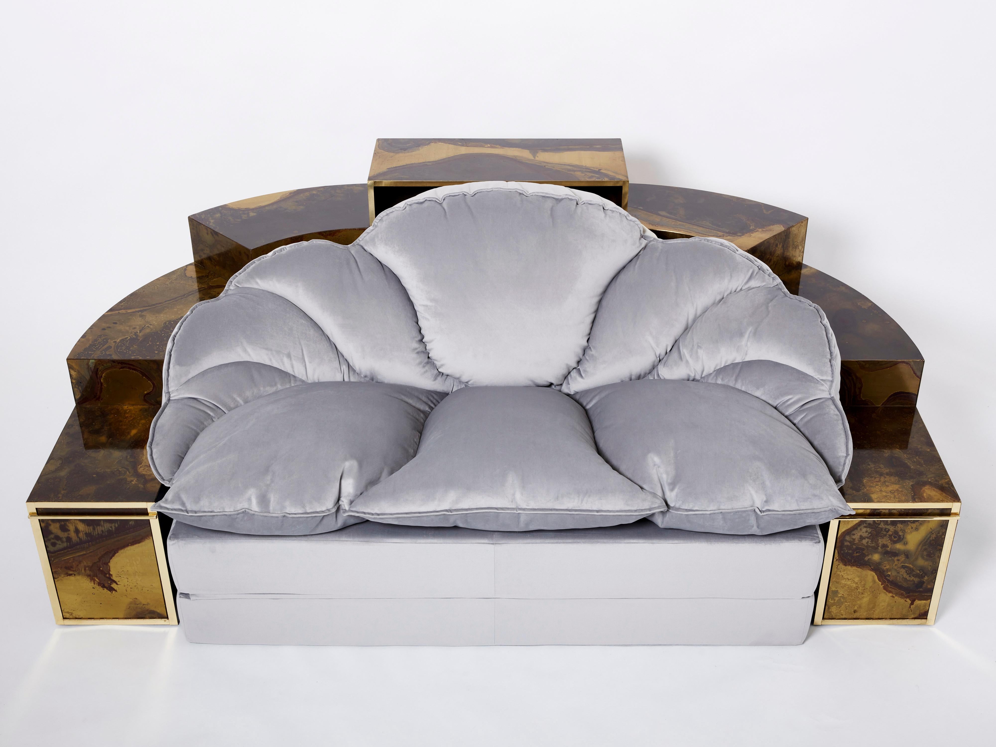 This unique sofa bed was created by Isabelle and Richard Faure for Parisian design firm Maison Honore in the late 1970s. Entirely covered by decorated oxidized and patinated brass all over, that was then fixed and varnished. The sofa features a