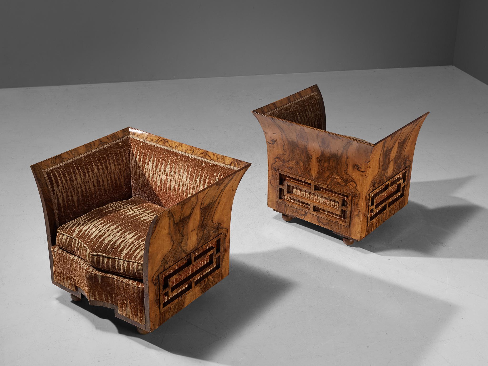 Pair of armchairs, walnut burl, velvet, fabric, Italy, 1930s.
This unique pair of easy chairs is designed according to the Art Deco principles that were in vogue in the 1930s. While the furniture's overall visual appearance was undoubtedly modern,