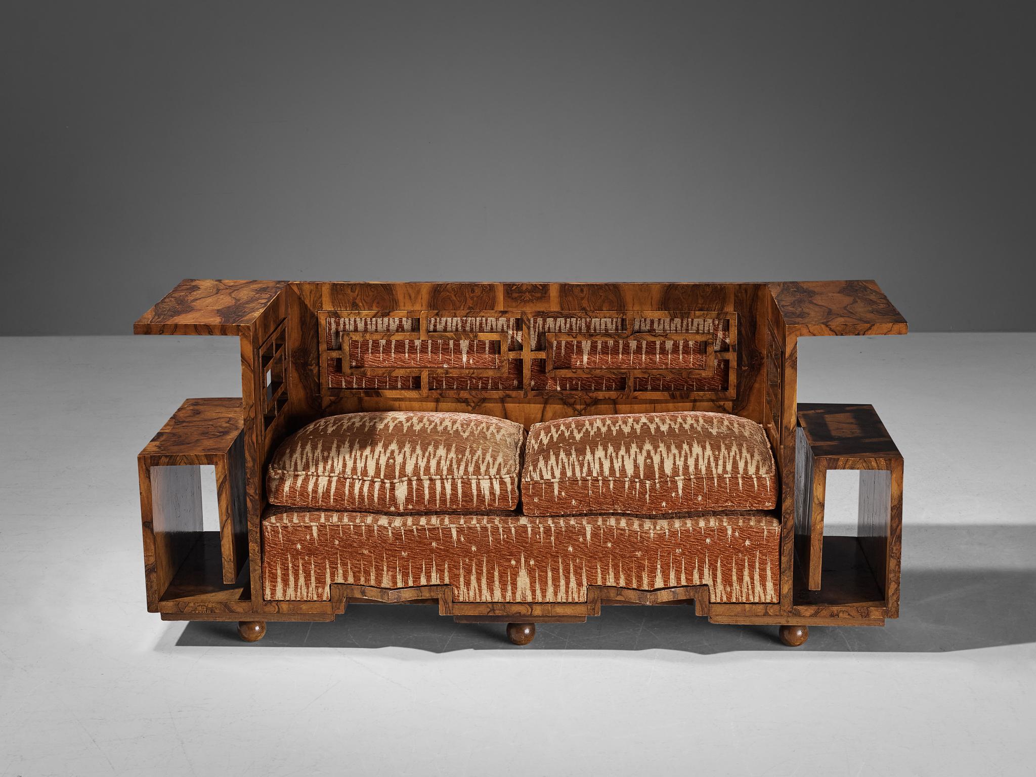 Sofa, walnut burl, velvet, fabric, Italy, 1930s.

This unique sofa is designed according to the Art Deco principles that were in vogue in the 1930s. While the furniture's overall visual appearance was undoubtedly modern, the movement's geometric