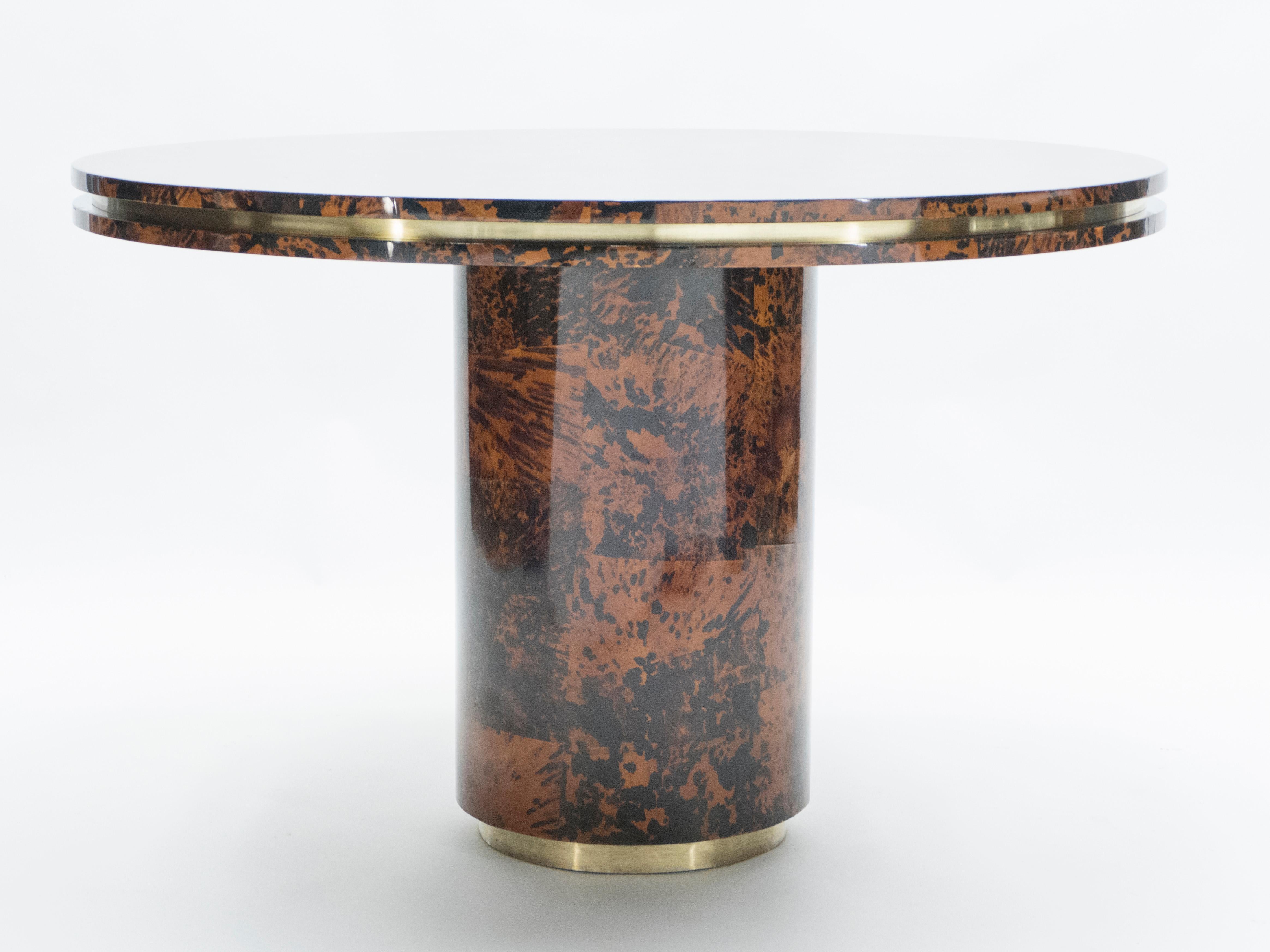 This unique midcentury round dining table, made from solid oak entirely covered by real turtle shells fully varnished, with brass addition, was made in Milano by a small design studio called Ottini in 1973. Ottini were making pieces of furniture to