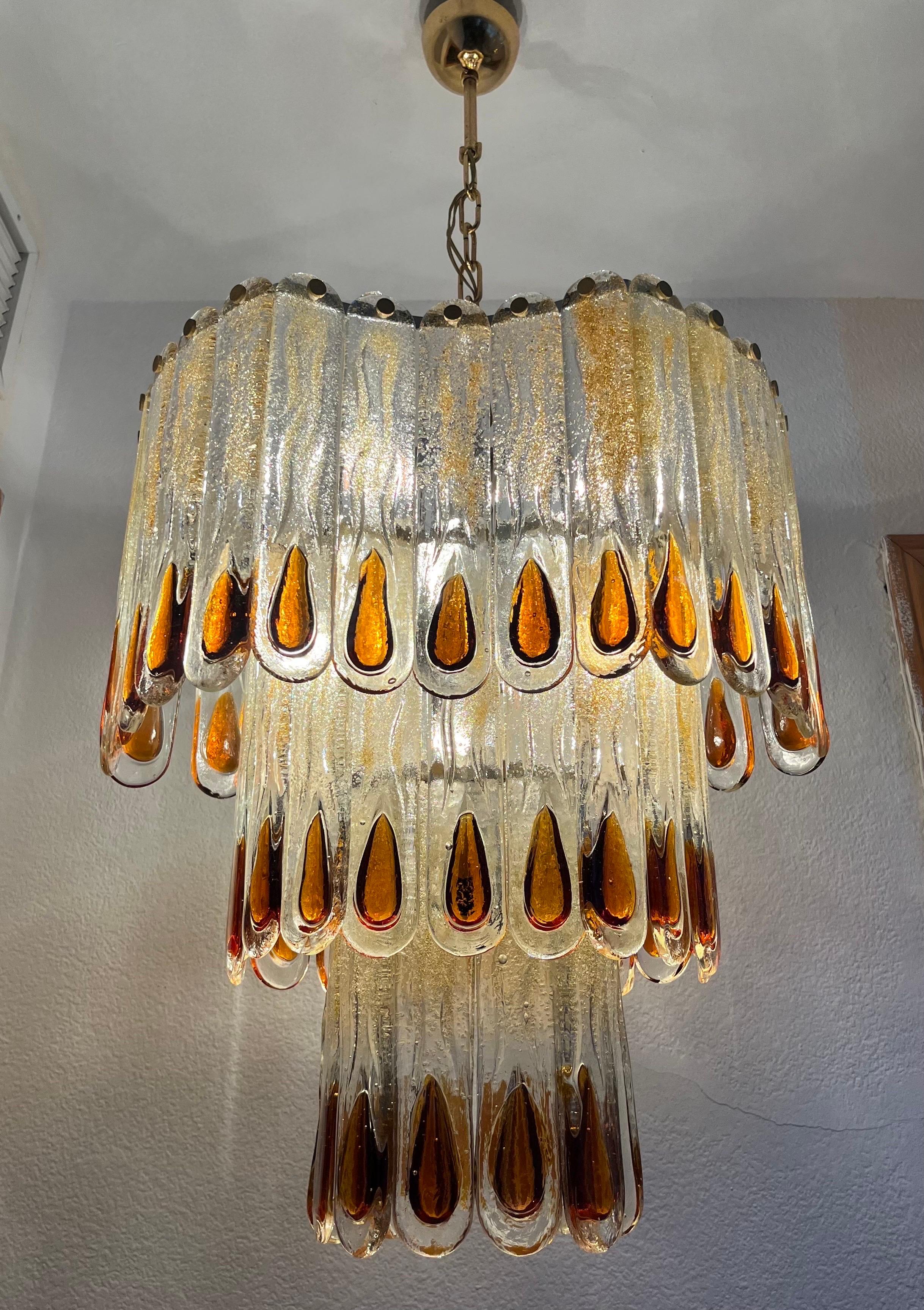 This marvelous and beauty Murano chandelier belongs to a Sicilian Palazzo.
This fixture was made during the 1970s in Italy for the Venice Company “Mazzega”.
Mazzega lie in the noble Venetian glassworking tradition; the firm was founded Angelo