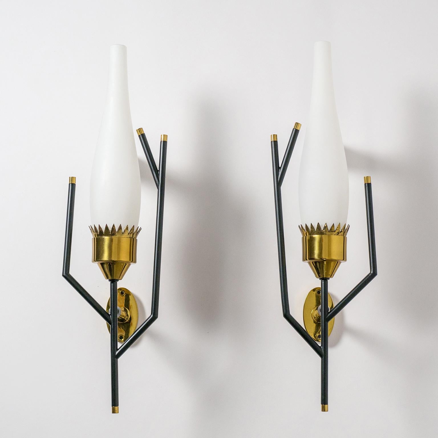 Exceptional pair of 1950s Italian brass and satinated glass sconces. Beautifully crafted these feature satin glass diffusers which sit in a crown shaped brass cup surrounded by modernist 