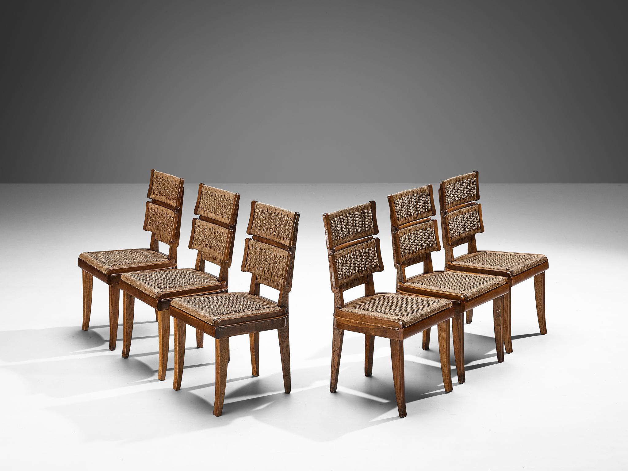 Set of six dining chairs, oak, papercord, Italy, circa 1935 

The exceptional quality of craftsmanship and precise attention to detail exhibited in this set of dining chairs suggests the work of a prominent Italian designer in the field of