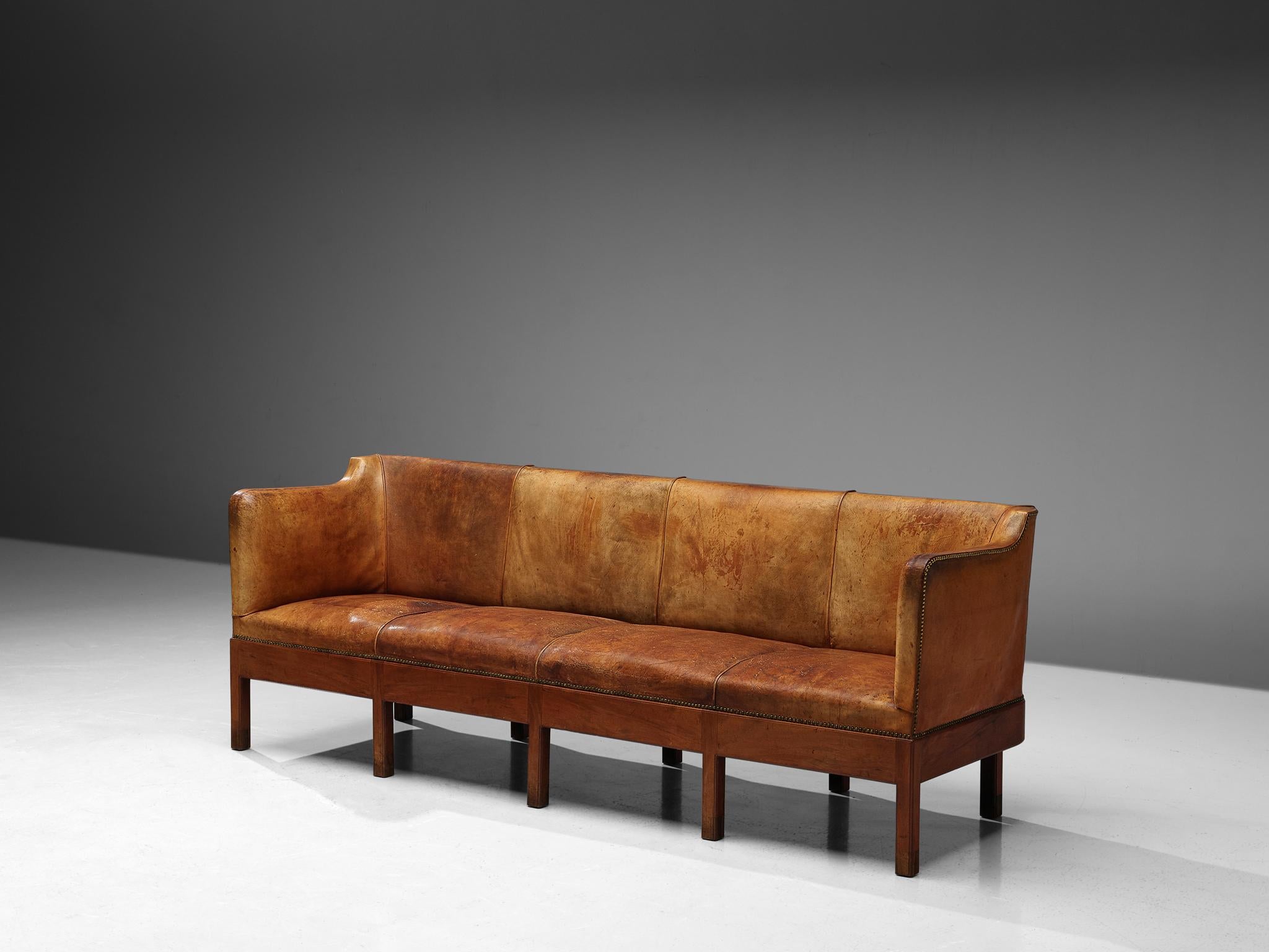 Jacob Kjaer, sofa, original Niger leather, brass, stained mahogany, Denmark, 1930s 

Exemplifying the quintessential essence of Danish design of the thirties, this rare sofa by Jacob Kjaer captures a harmonious blend of understated simplicity and