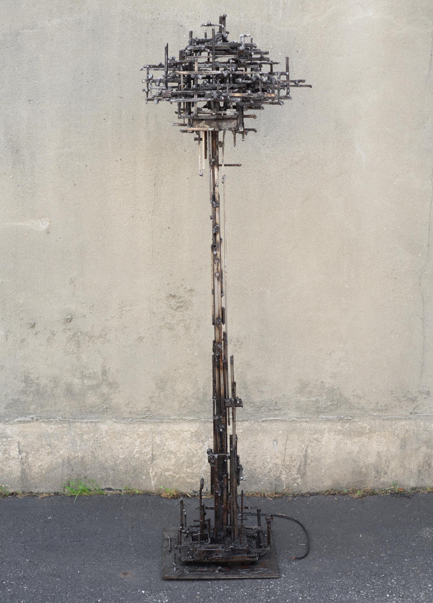 Designed and studio-made by American designer and craftsman James Bearden, this awesome floor lamp looks like it entered this world from a different dimension. Devoid of any curves whatsoever, the design is made completely of square steel. Square
