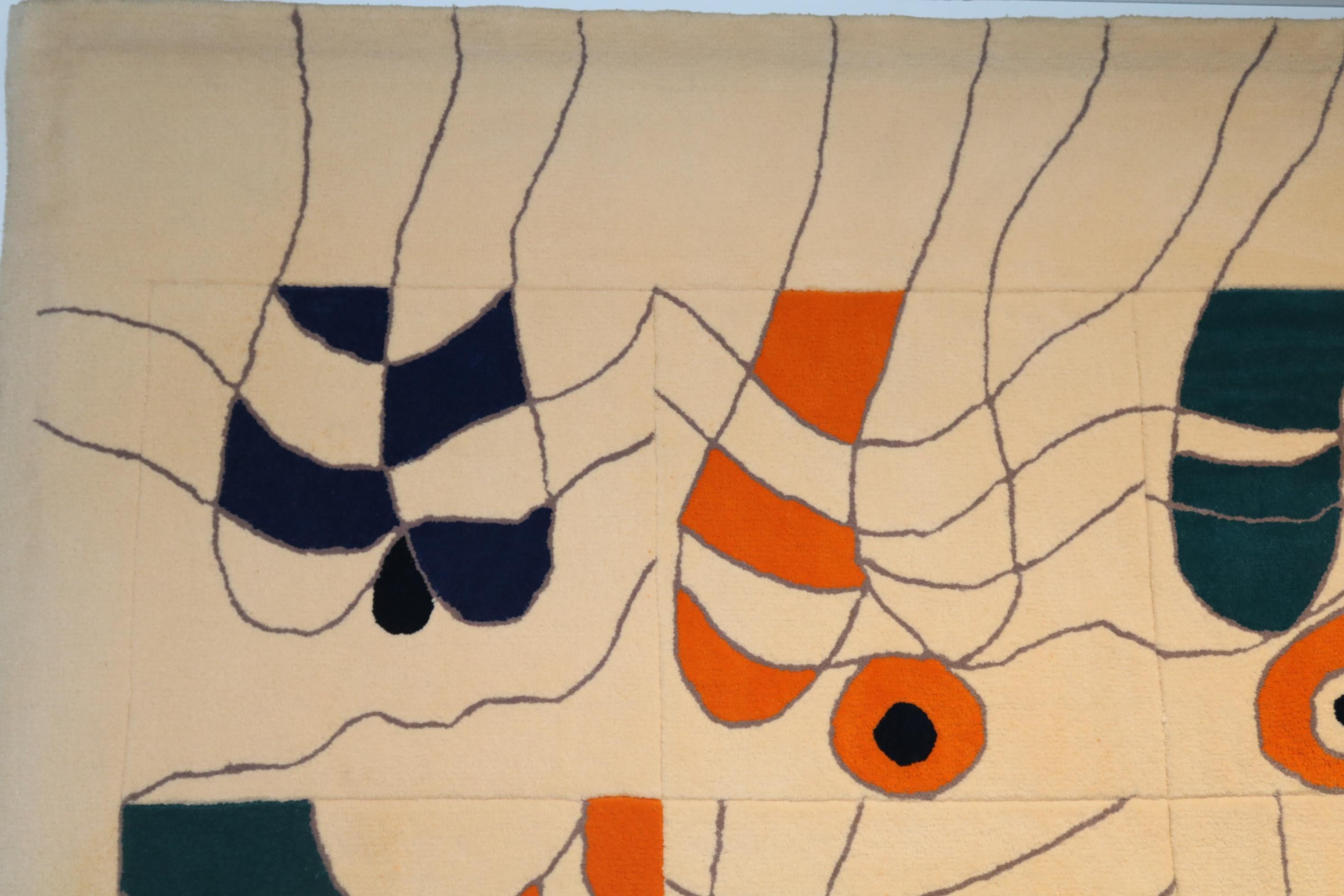 A beautiful, one of a kind tapestry, designed by Jan Snoeck in the Netherlands, circa 1990.

The cream colored rug is decorated with thin grey lines, coloured with orange, blue, red and black. The playful, colourful style is iconic for the work of