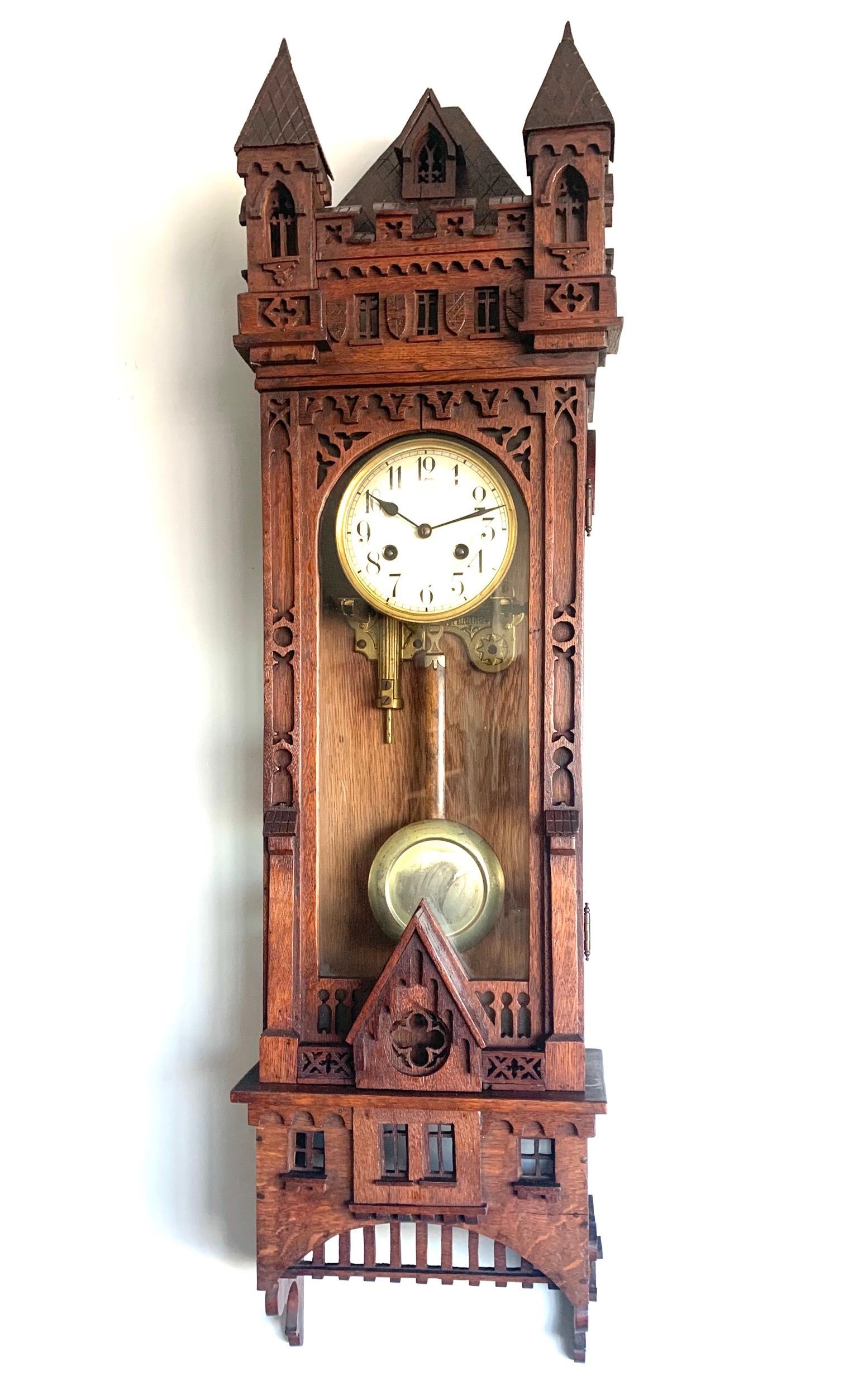 Stunning clock for the collectors of rare and truly stylish Gothic antiques.

Gothic wall clocks are a rare find and this more than three feet tall specimen probably is the tallest and the most elaborate we have ever seen. All handcrafted and hand