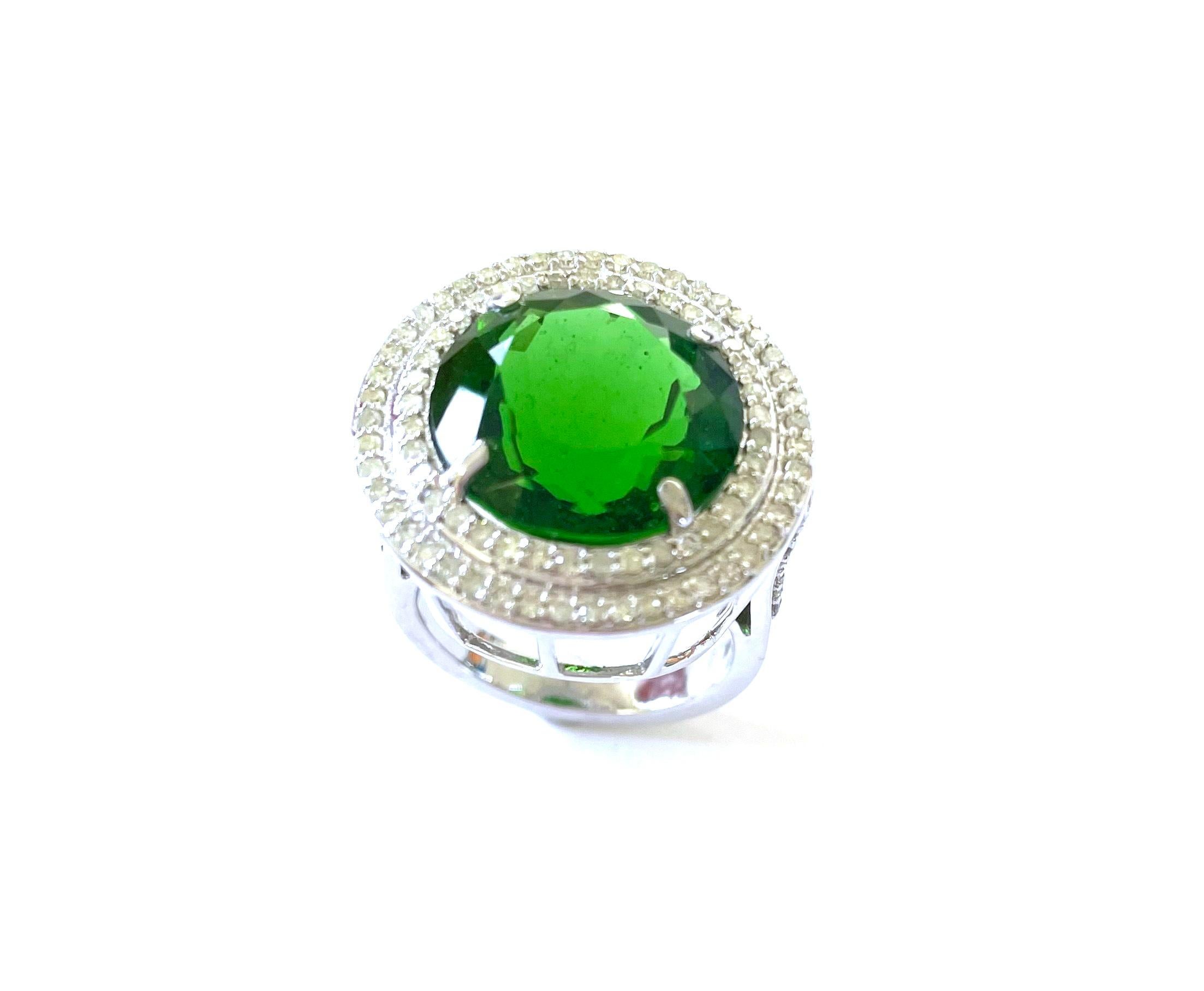 Description
Extremely rare and large size vibrant green Chrome Diopside with pave diamonds ring.
Item # R172

Materials and Weight
Chrome Diopside, 14 x 10mm, round cut, 11 carats.
Pave diamonds, 1.01 carats.
14k white gold.

Dimensions
Size US