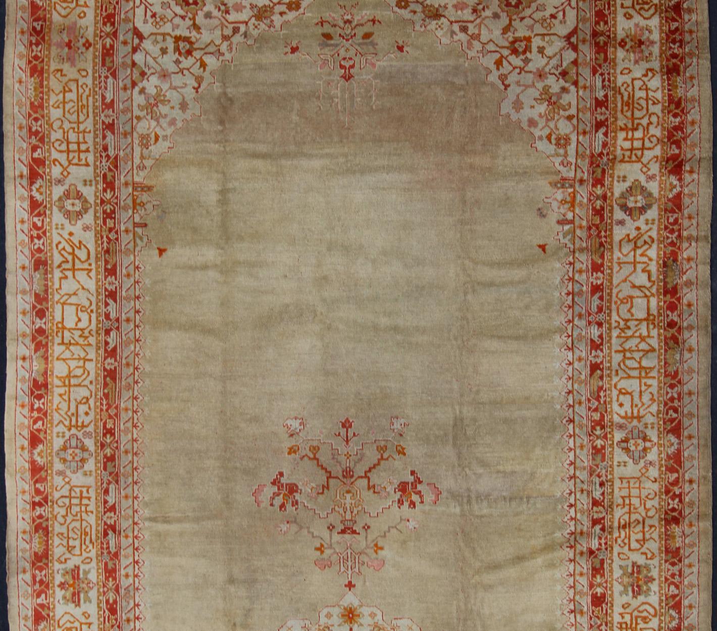 Hand-Knotted Large Antique Oushak Rug in Taupe / Light Green Background and Red Border For Sale