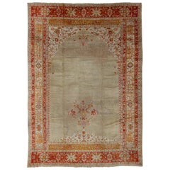 Large Antique Oushak Rug in Taupe / Light Green Background and Red Border