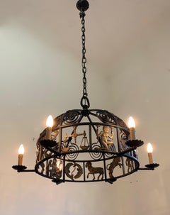 Unique and Large Arts & Crafts Wrought Iron Chandelier with Bronze Zodiac Signs