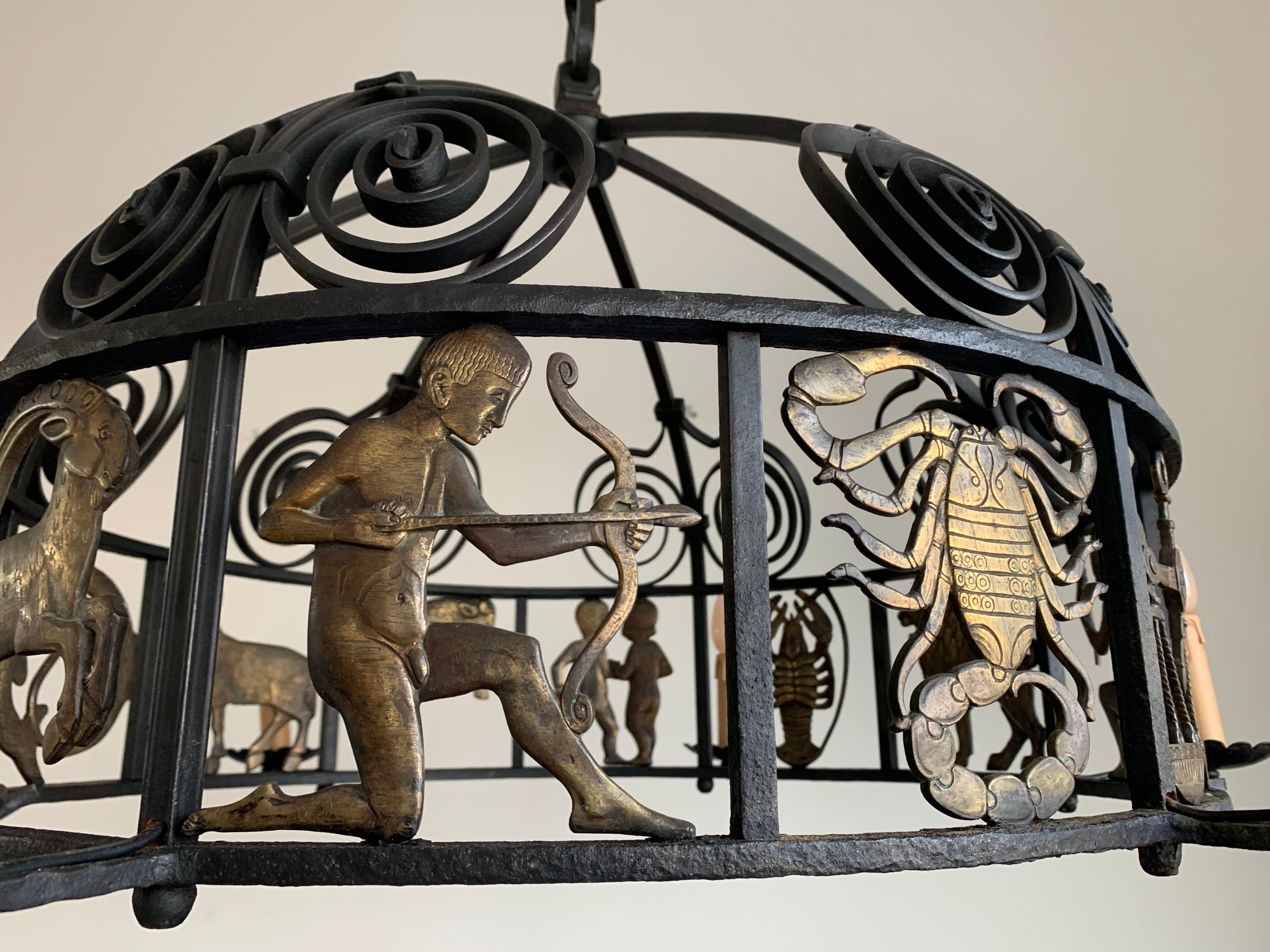 European Unique and Large Arts & Crafts Wrought Iron Chandelier with Bronze Zodiac Signs