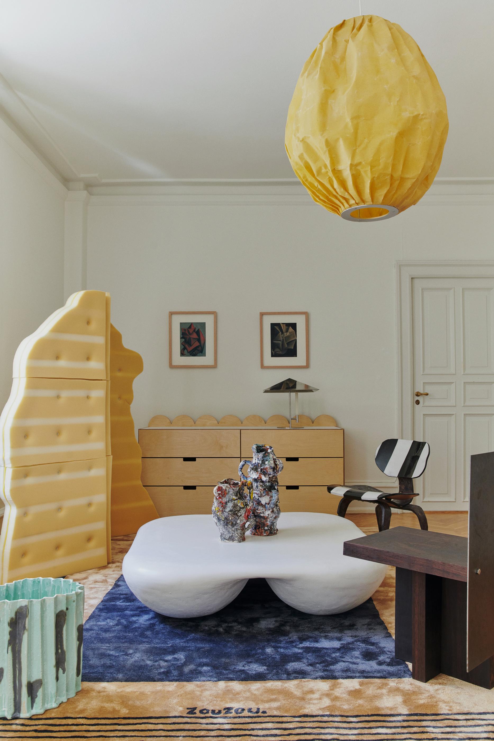 Beeswax is a pendant light sculpture for double-height ceilings by Pablo Bolumar. Made of beeswaxed canvas, the lampshade generates a warm textured light, accentuating the pleats and wrinkles of the making. The hanging artwork carries a subtle scent