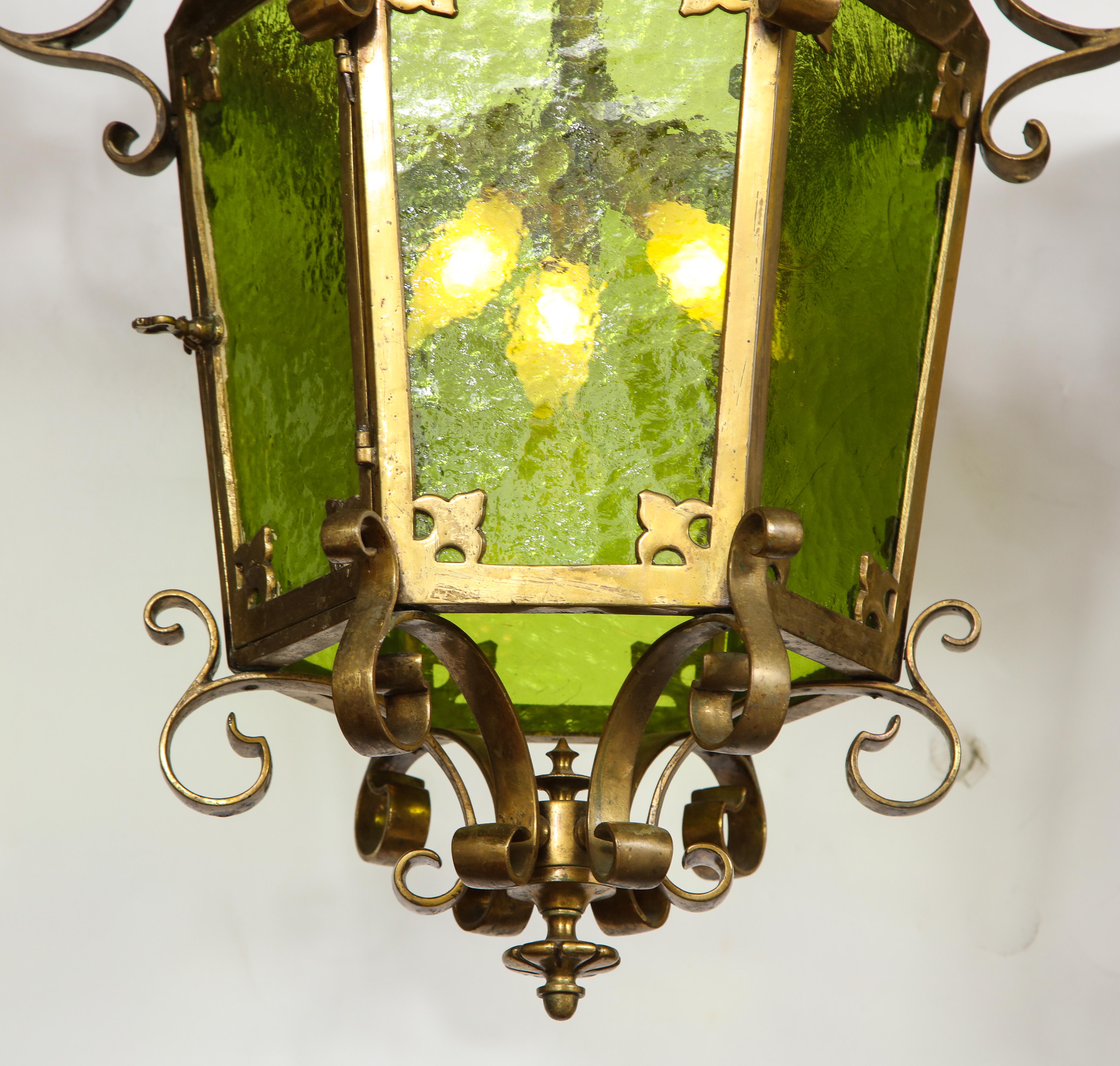 Unique large bronze scrolled lantern with green glass and three electrified sockets