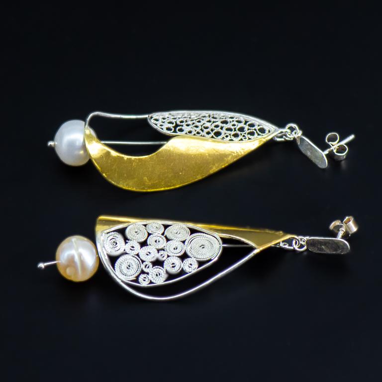 You will never see an identical pair of contemporary filigree nautical sailing earrings to these, which are designed and handcrafted using recycled silver and pearls then partly gold plated by international award-winning Tara Lois, whose sought
