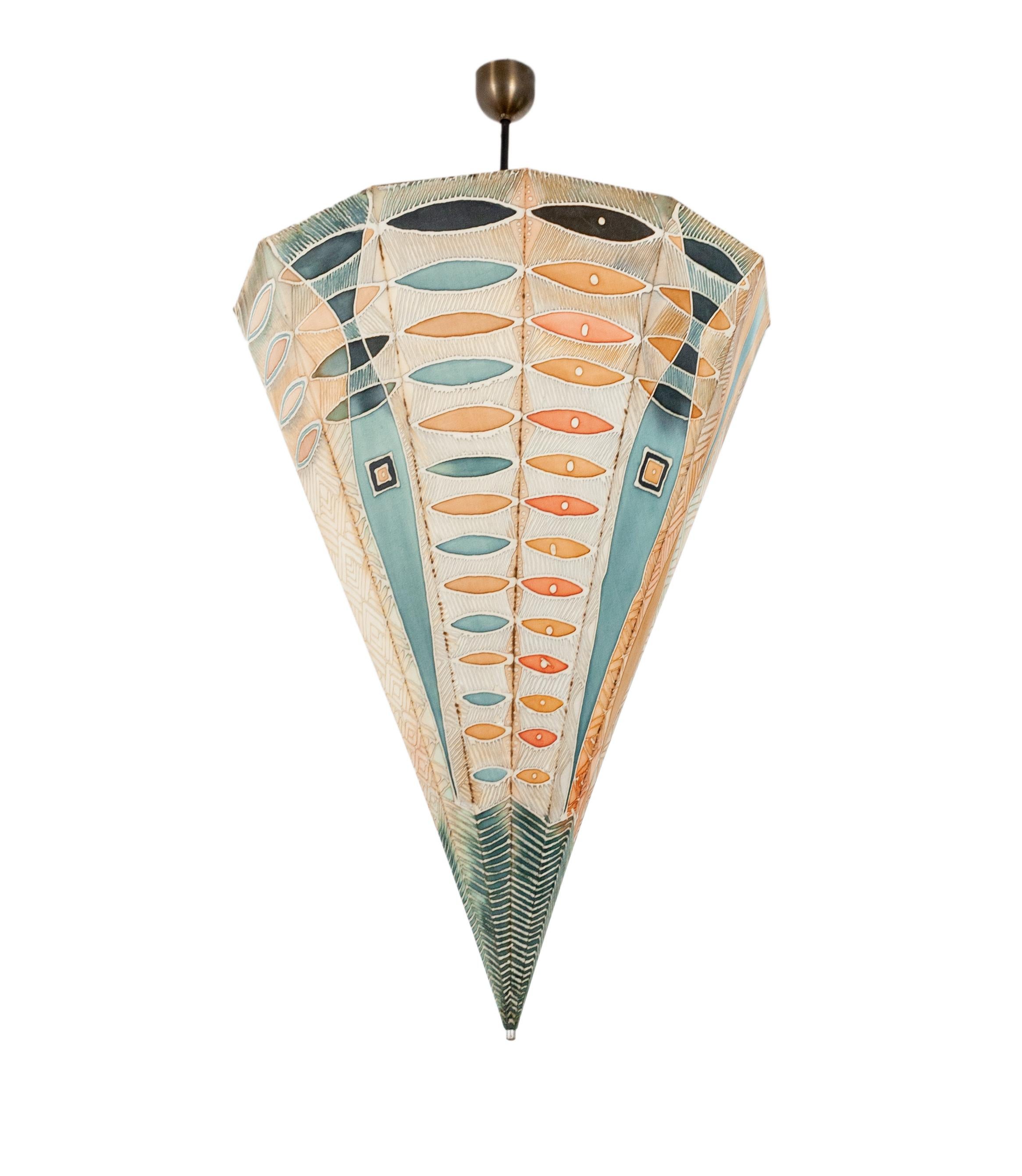 Large umbrella ceiling light. Handmade in the 1960s. Typical for that era, is the use of Batik.
The frame is made off soldered small brass tubes. Surrounded with this beautiful Batik fabric.
When lit it looks like stained windows. Looks great in a