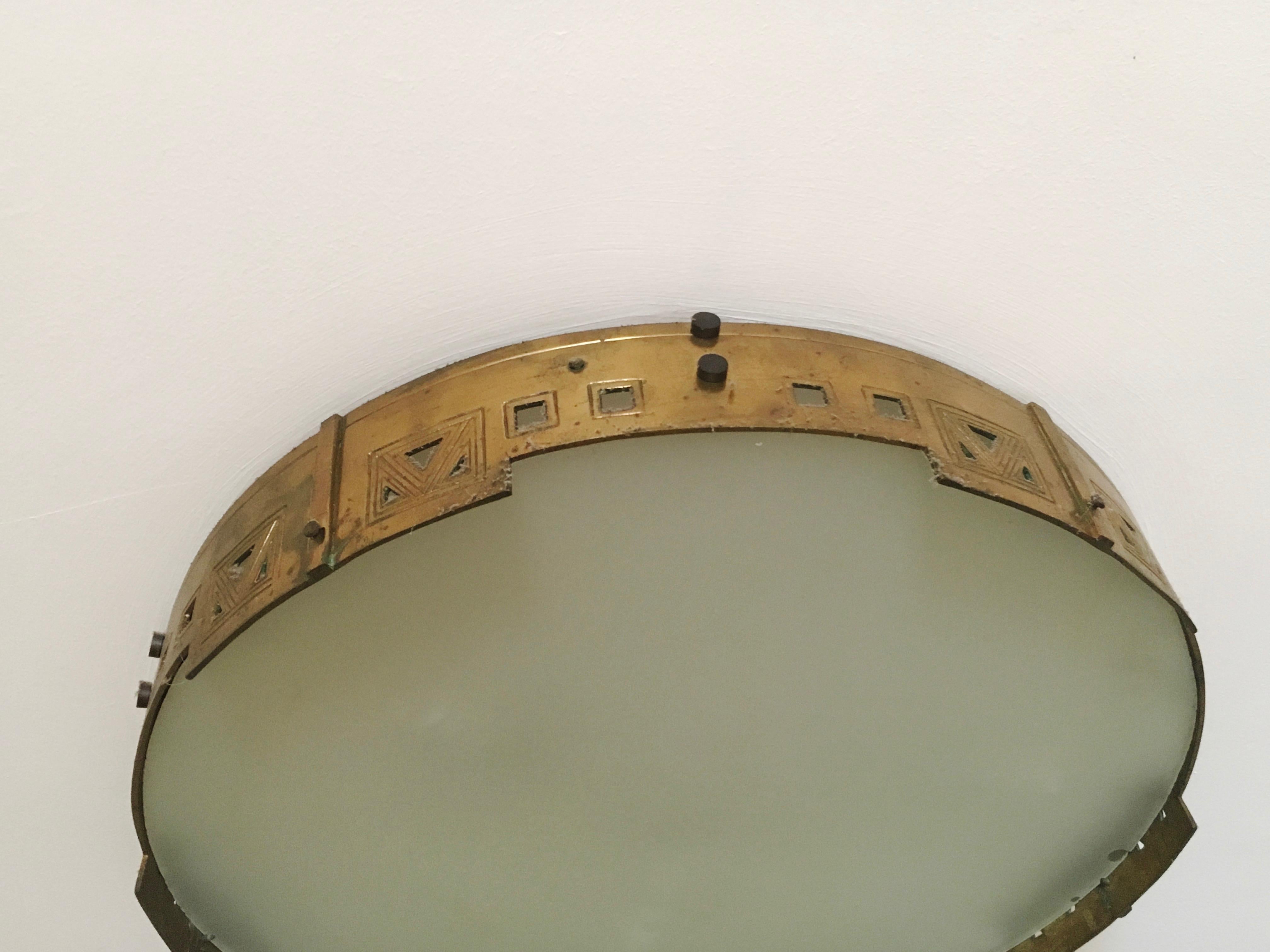 Unique large Spanish Art Deco brass flush mount ceiling lamp, 1920s. Beautiful combination of the 3 basic shapes, triangle, square and circle. Simple and classic Art Deco combination.
The beauty of the simple shapes.