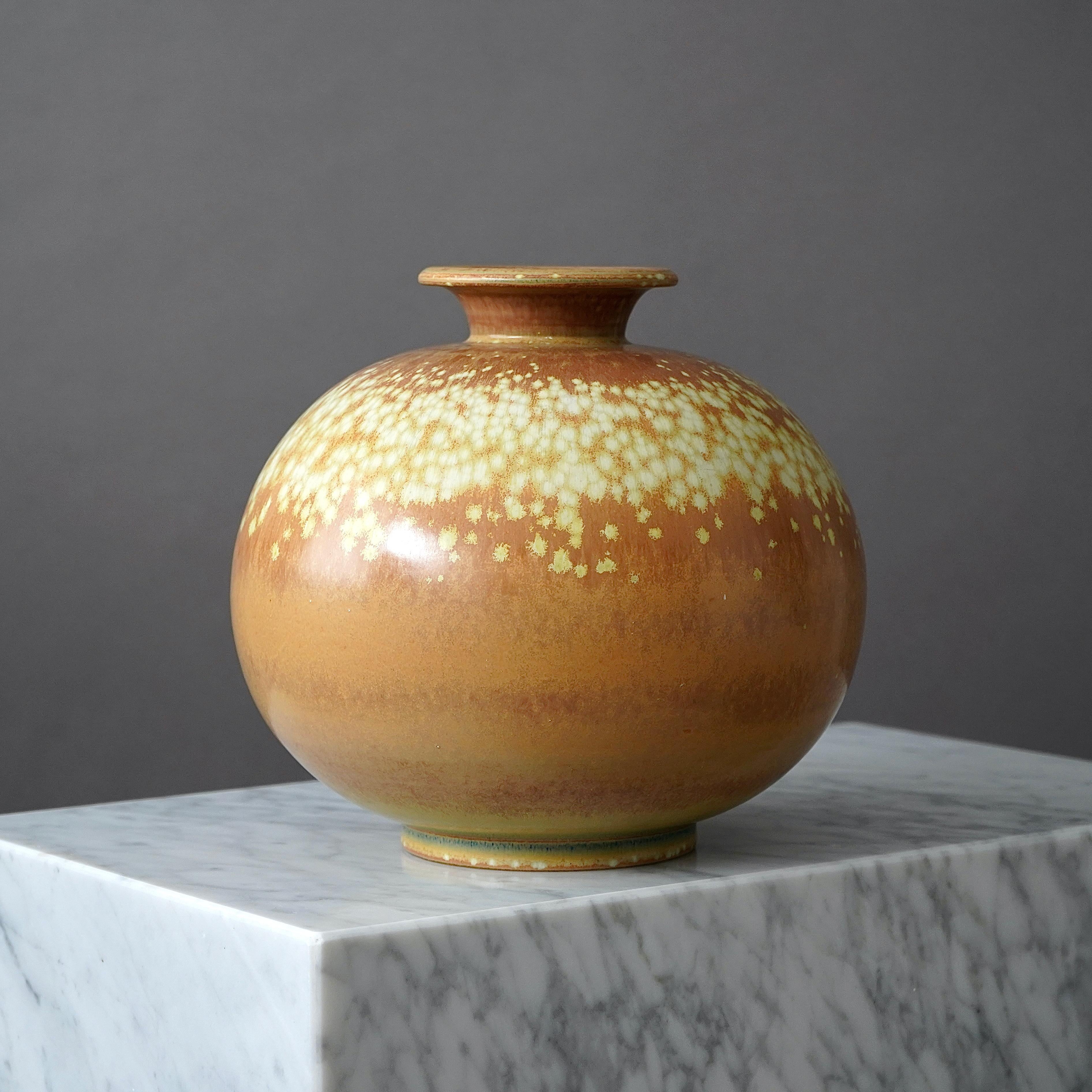 A large and unique stoneware vase with amazing glaze. 
Designed by Gunnar Nylund for Rorstrand, Sweden, 1940s.  

Excellent condition. Incised signature 