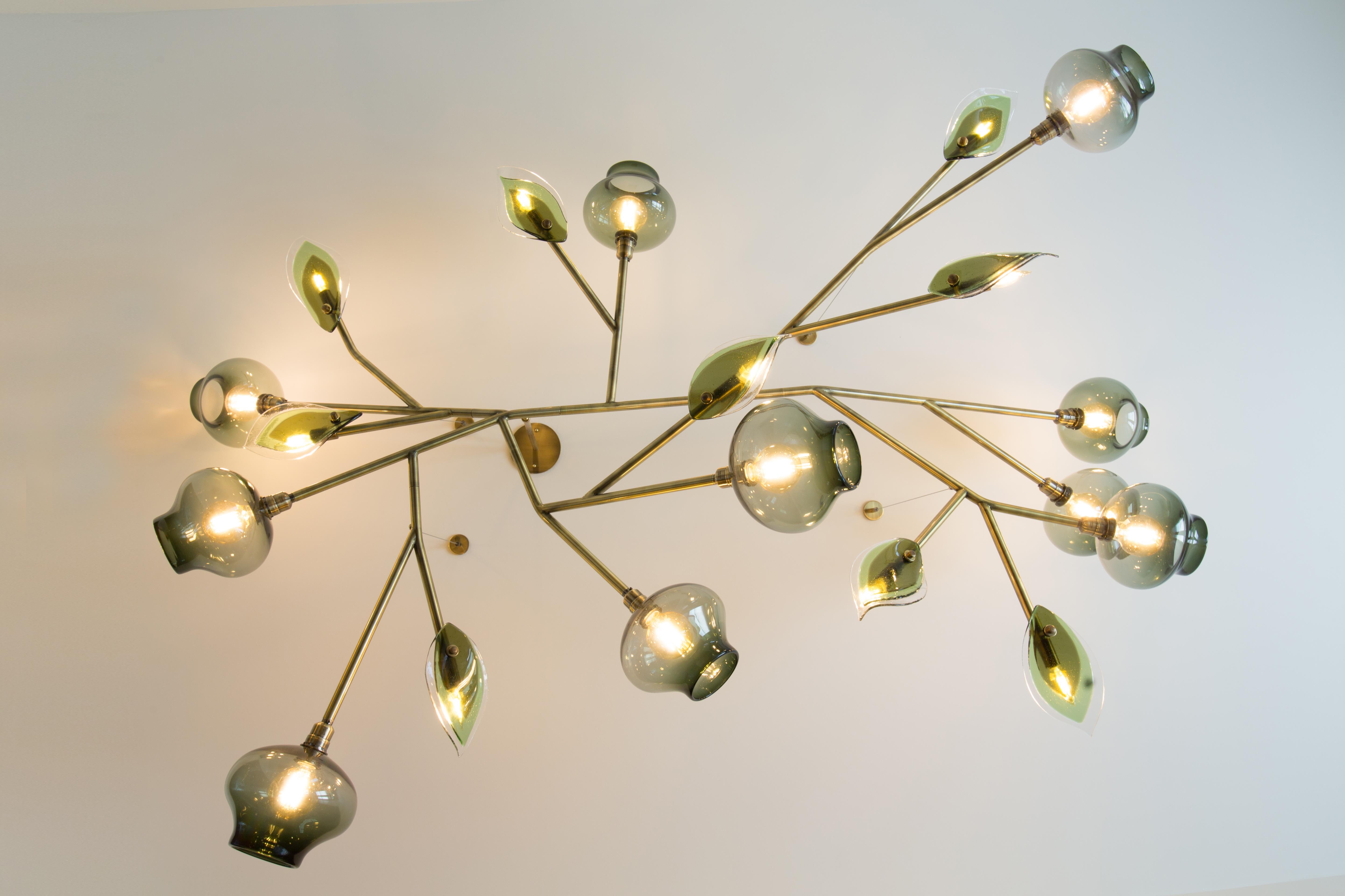 Unique leaf chandelier by Feyzstudio
Dimensions: W 213.3 x D 76 x H 45.7 cm
Materials: Brass, steel, glass.
Glass color, metal finish, dimensions can all be customized as our pieces are made-to-order.

FEYZ Studio is a New York based,
