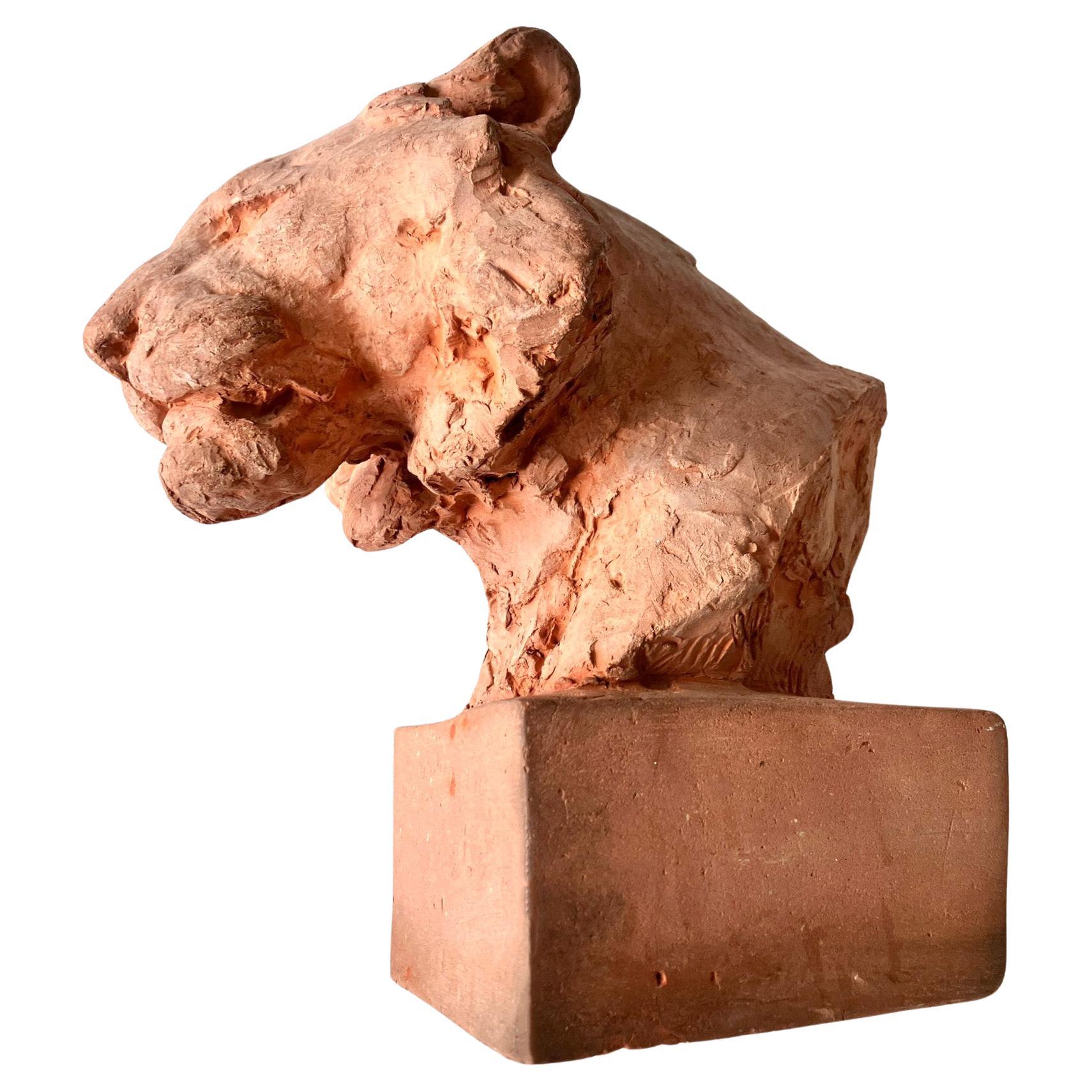 Par Cocry. 
Tête de lion, terre cuite, vers 1930-1950
Signé par l'artiste 