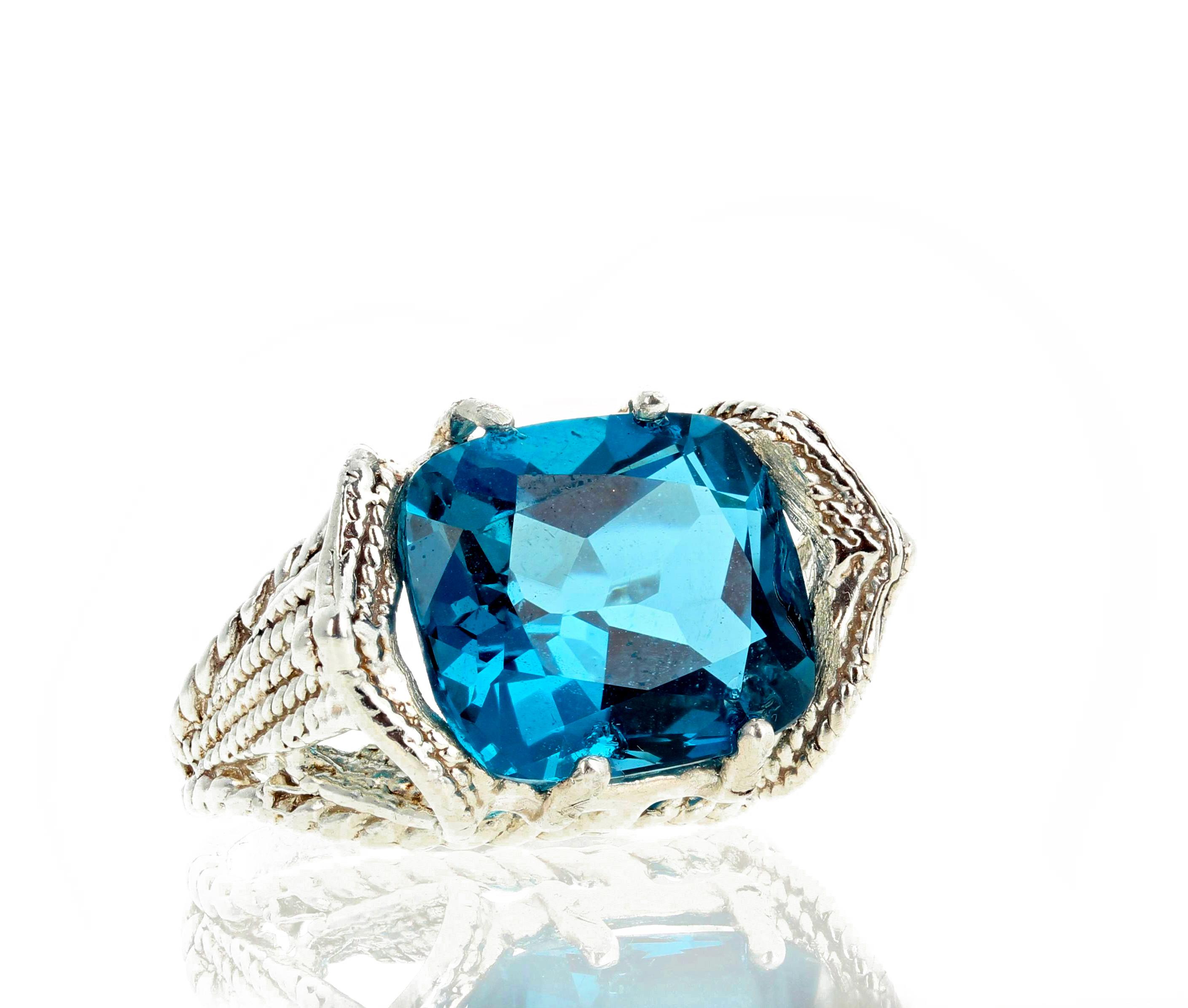Glittering HUGE bright 10.95 Carat London Blue Topaz set in a unique sterling silver ring size 7 (sizable for free).  The Topaz measures 14 mm x 12 mm and is perfect for your next dinner party.  