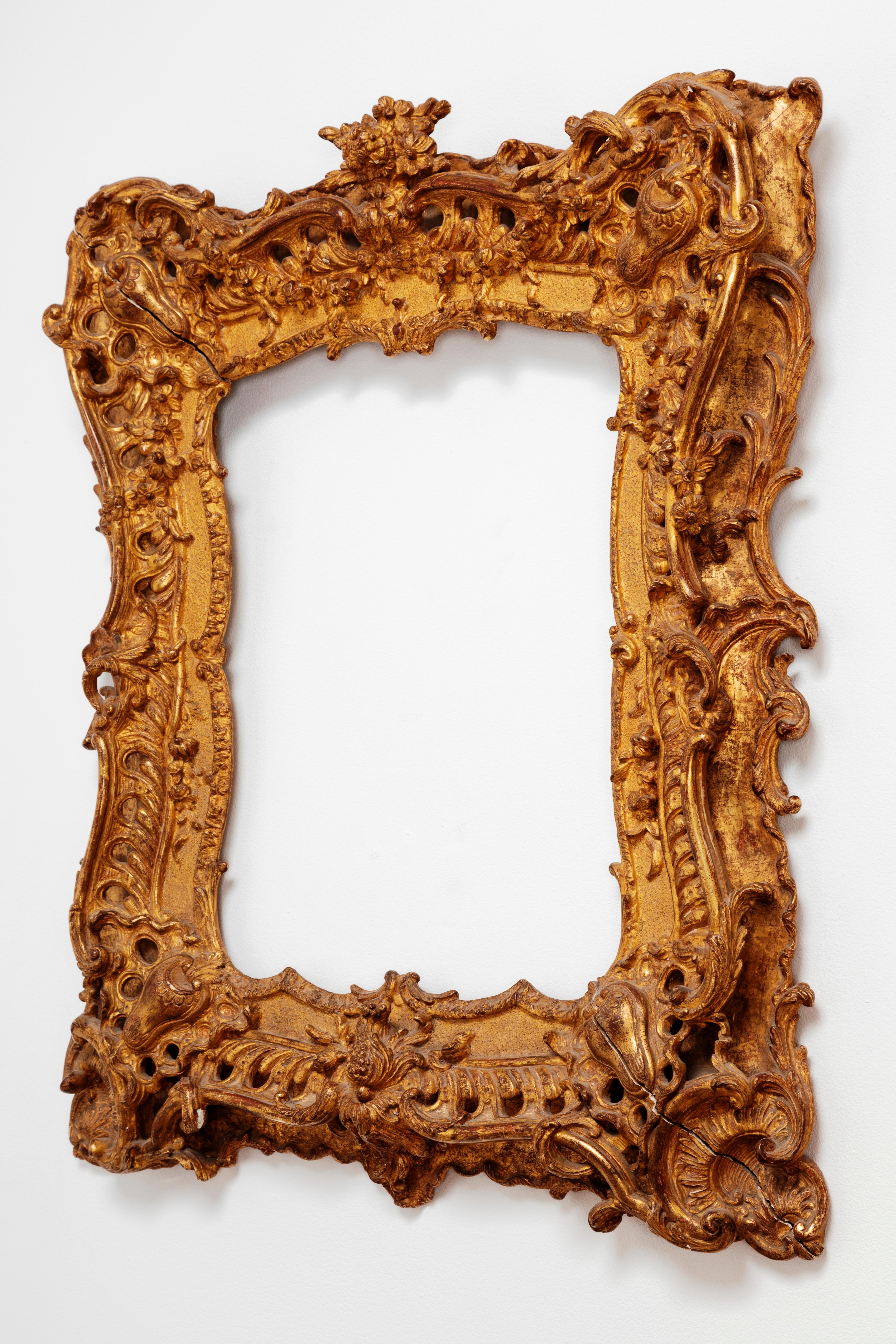 Unique Louis XV period French Rococo extraordinary carved giltwood frame/mirror
France, circa 1735.

Its prodigious carving and gilding makes it the perfect example of the 