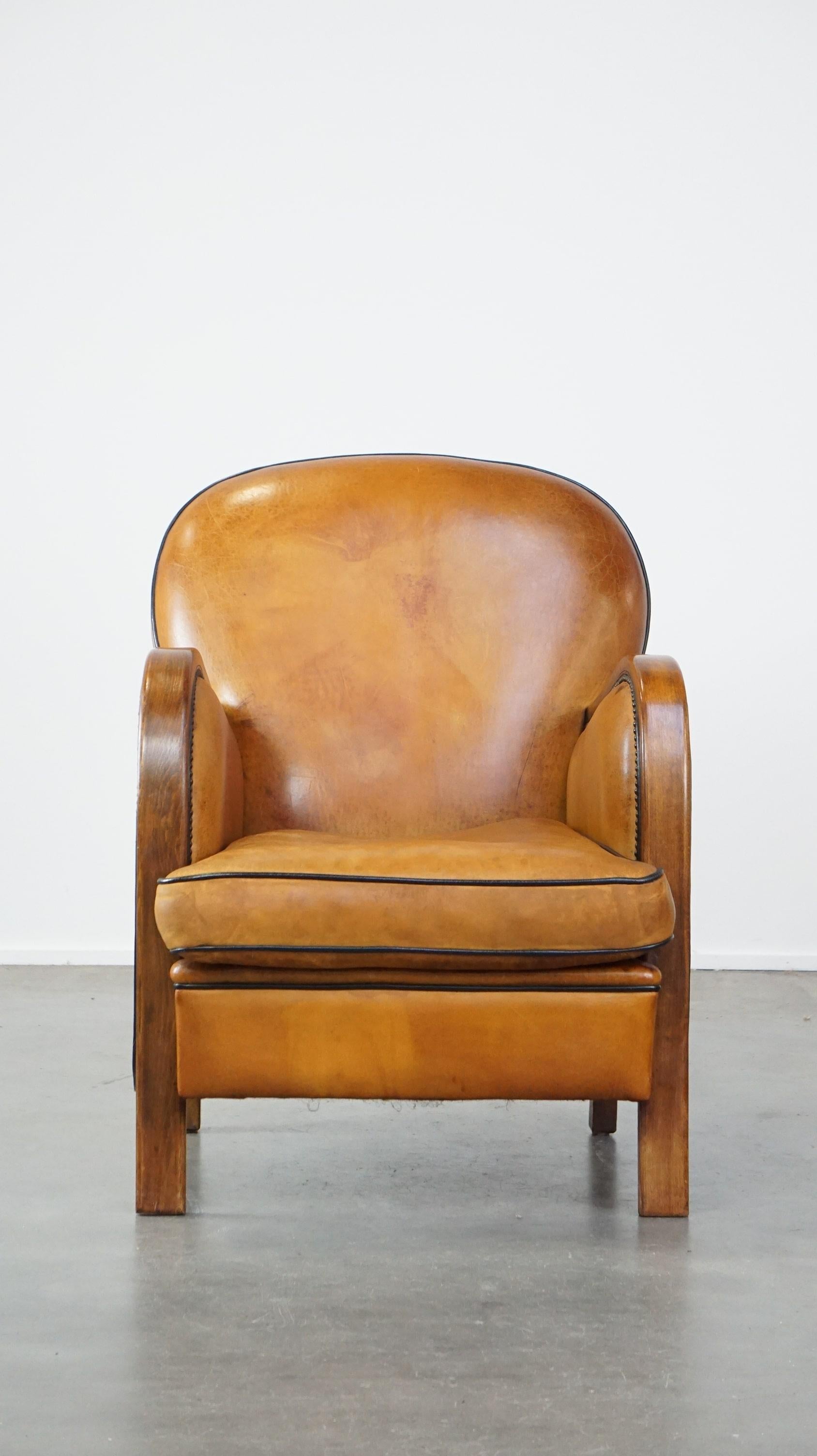 Offered this unique, luxurious sheep leather armchair combined with wood and finished with decorative nails.

This amazing sheep leather armchair is a real eye-catcher with its unique design! It is combined with wood and correctly finished with