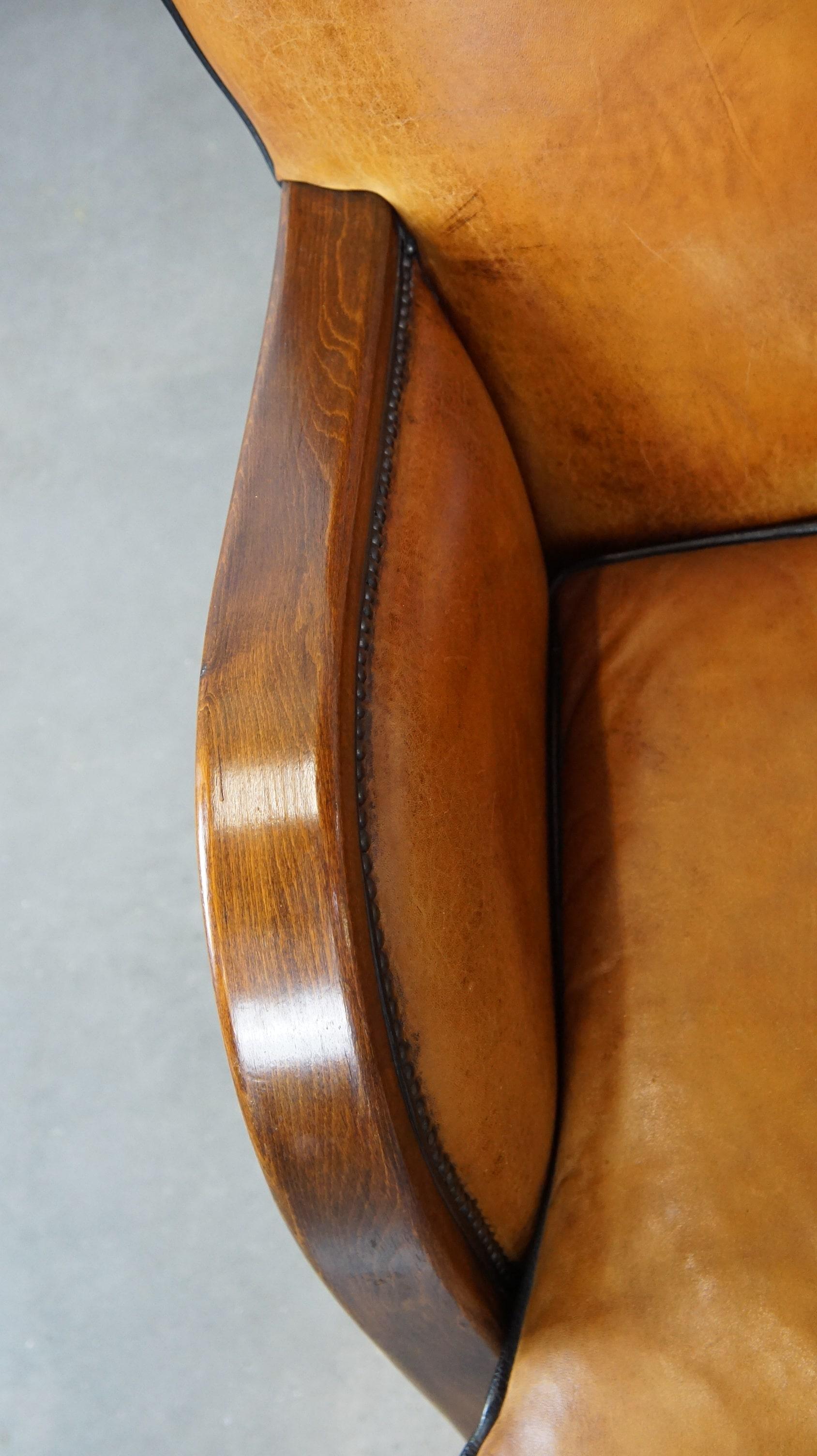 Leather Unique, luxurious sheepskin armchair combined with wood For Sale