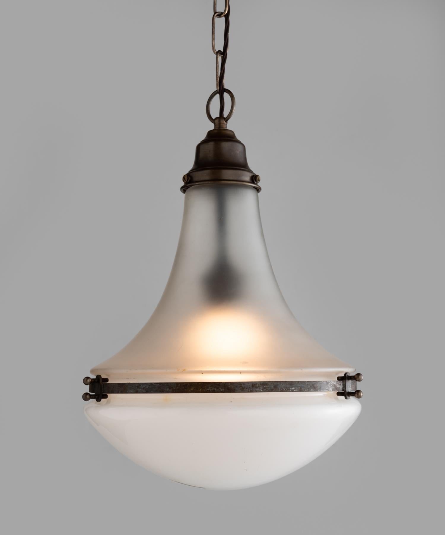 Unique Luzette Pendant by Peter Behrens, Germany, circa 1930.

With contrasting top and bottom shades, brass hardware and beautiful patina. Drop is adjustable.

9