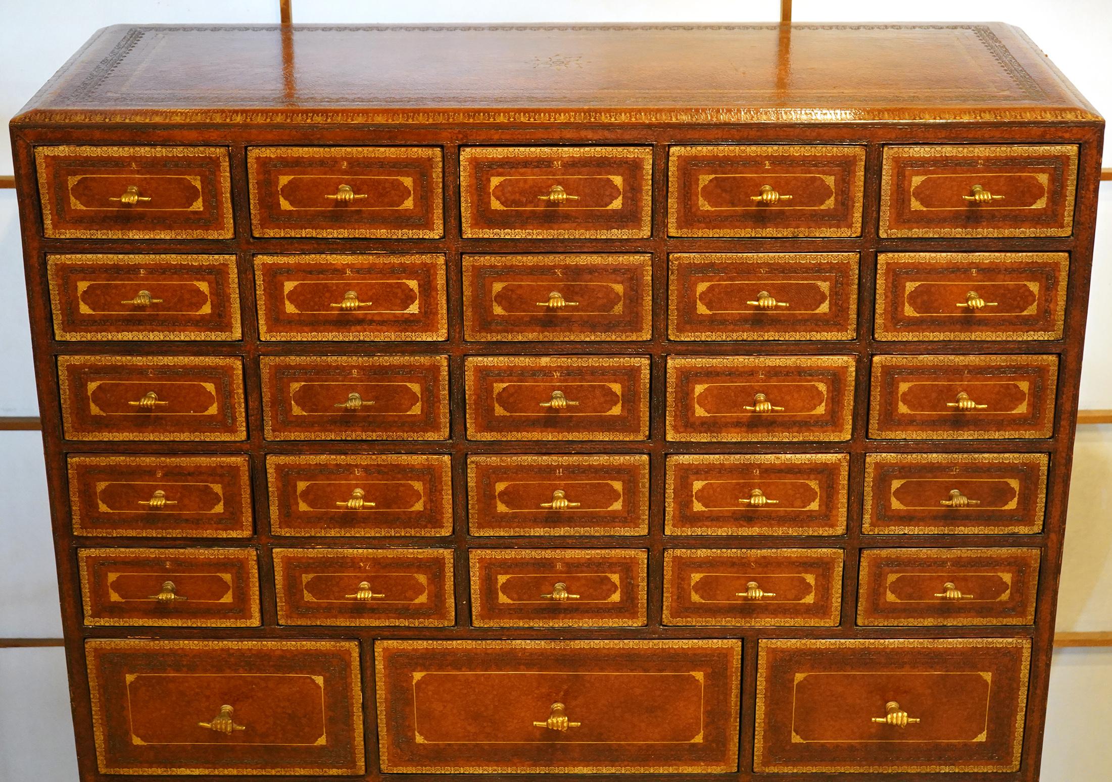 Maitland Smith Tooled Leather Chest of Drawers. Unusual fist pull handles. 42