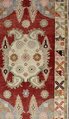 Vintage Turkish Oushak Rug with Deep Red Field and Soft Green and Peach Accents