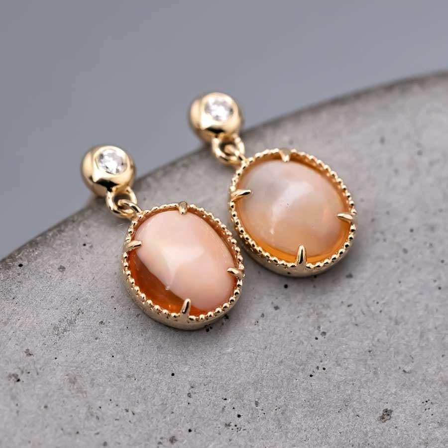 Unique Mexican Egg Fire Opal & Diamond Drop Earrings in 18K Yellow Gold.


Free Domestic USPS First Class Shipping! Free Gift Bag or Box with every order!

Opal—the queen of gemstones, is one of the most beautiful gemstones in the world. Every piece