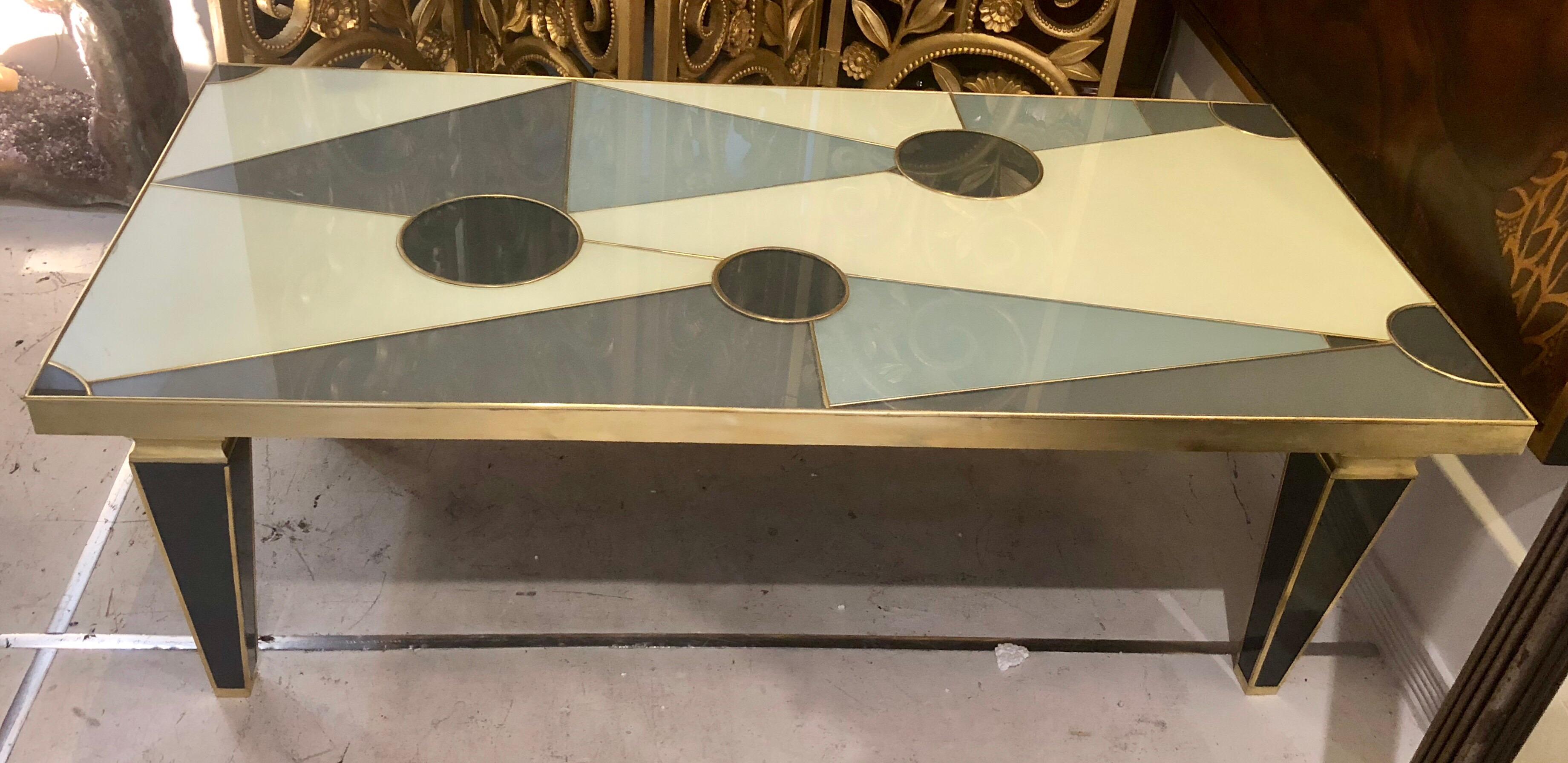A Beautiful Pattern of Reverse Painted Glass and Brass Top this Sublime Italian Coffee Table, Circa 1950s