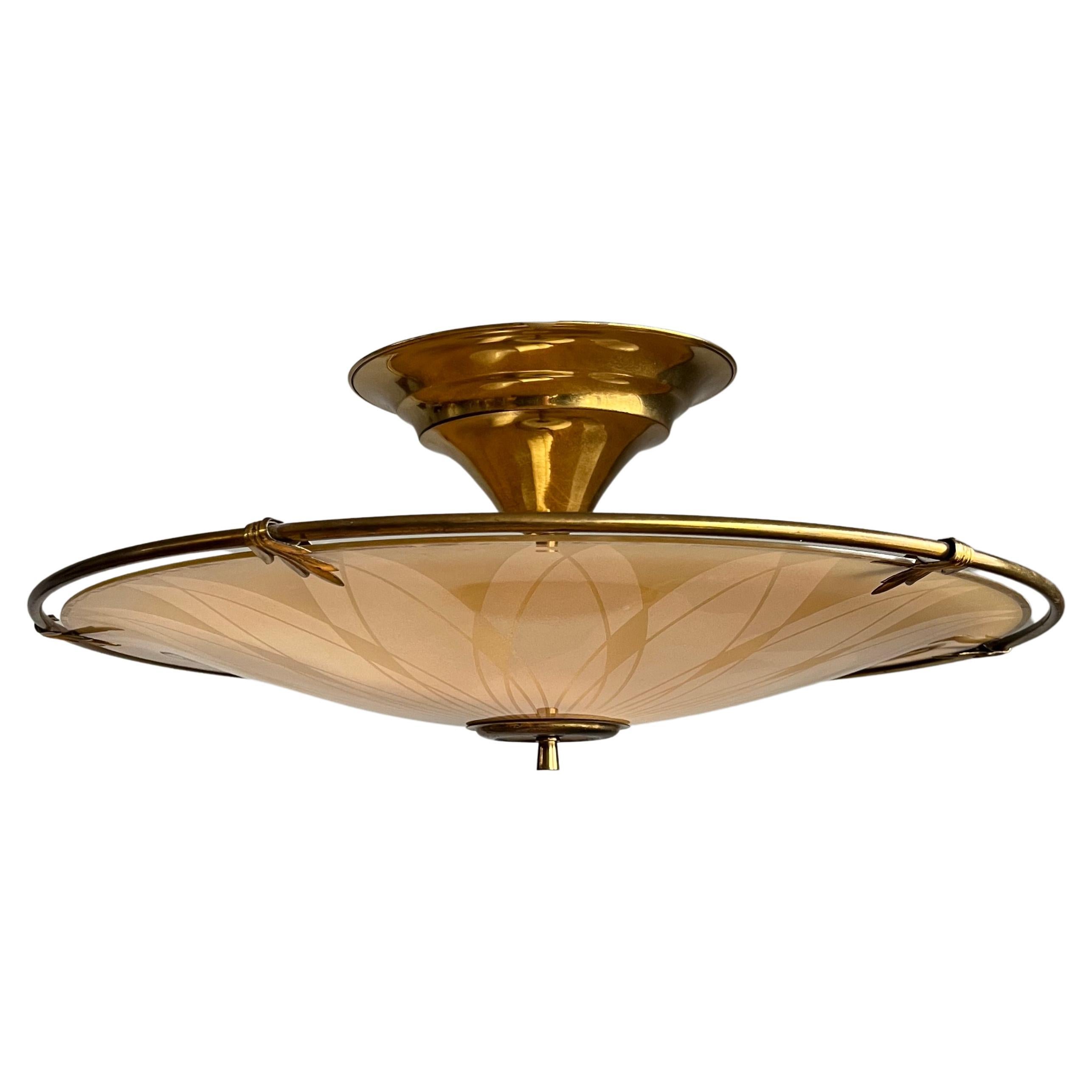 This large and pure Midcentury Modern, three lights fixture is another one of our recent great finds. 

This unique light fixture from the mid twentieth century era has a beautiful look and feel and you will hardly ever find a light fixture with a