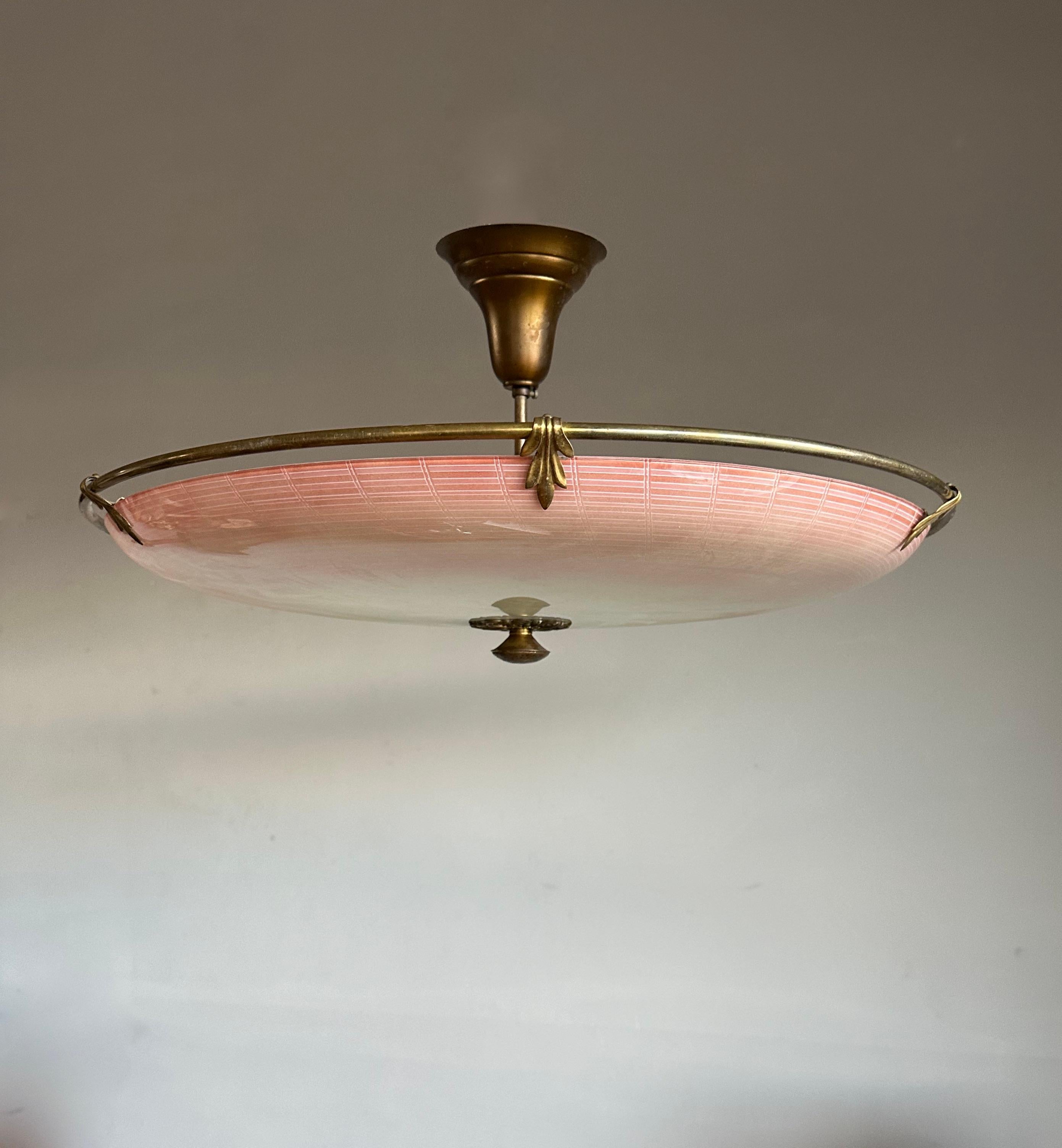 This extra large and pure Mid-Century Modern, three lights fixture is another one of our recent great finds. 

This unique light fixture from the mid twentieth century era has a beautiful look and feel and you will hardly ever find a light fixture