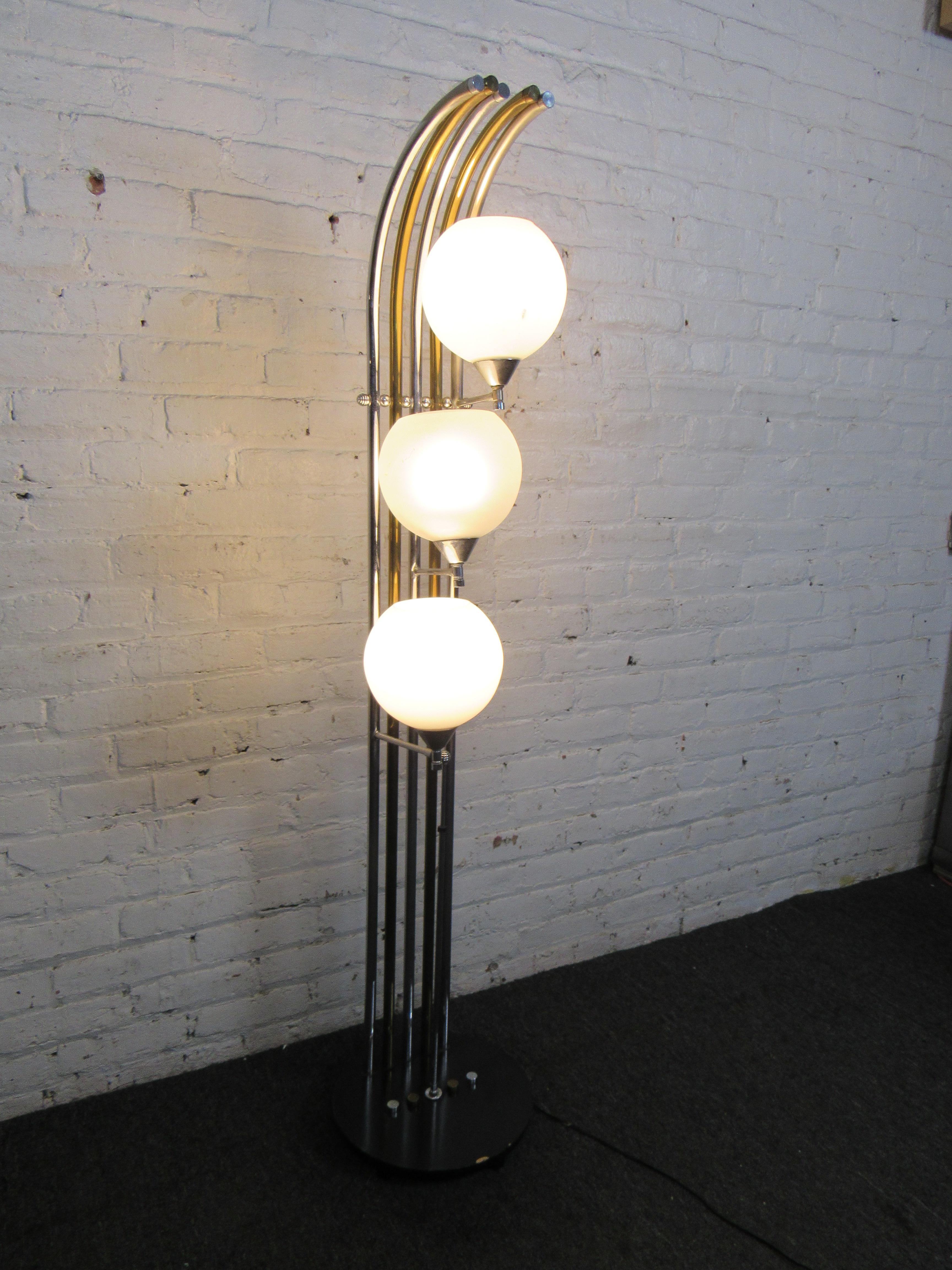 This interesting vintage floor lamp uses mixed metals and three heads for a unique appearance. Please confirm item location with seller (NY/NJ).