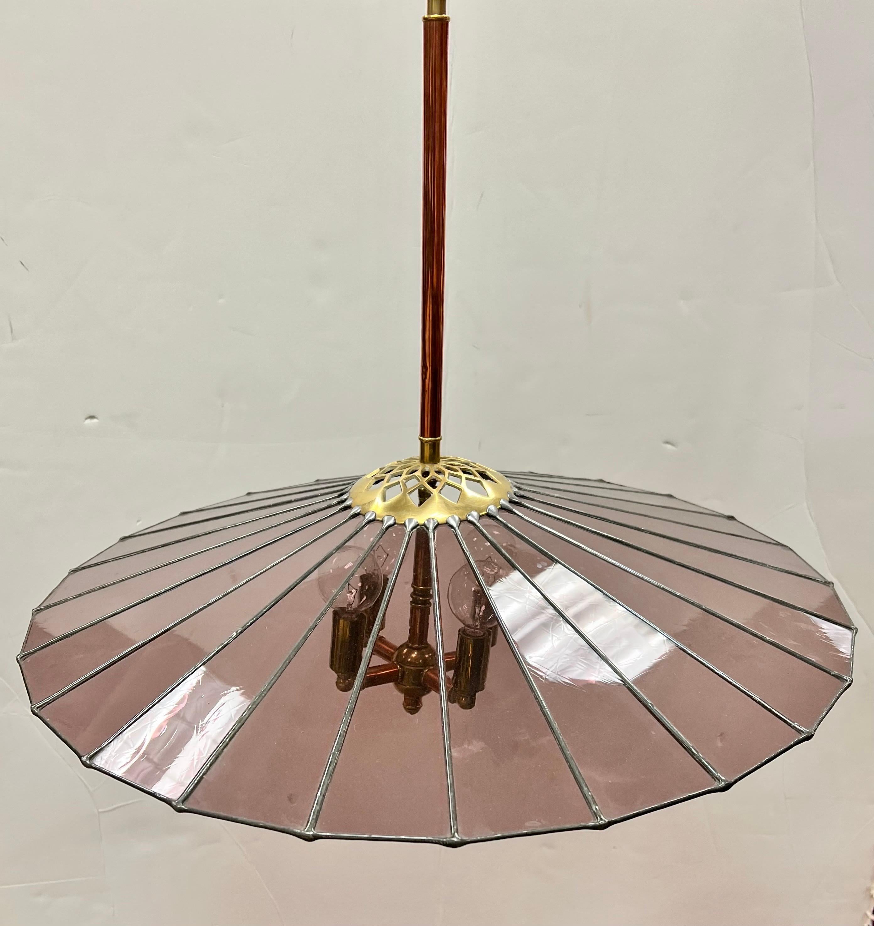 Exquisite hand crafted umbrella shaped stained glass light fixture in a beautiful pink amethyst color supported by copper rod. Why not own the best? Made in Italy but wired for the USA.