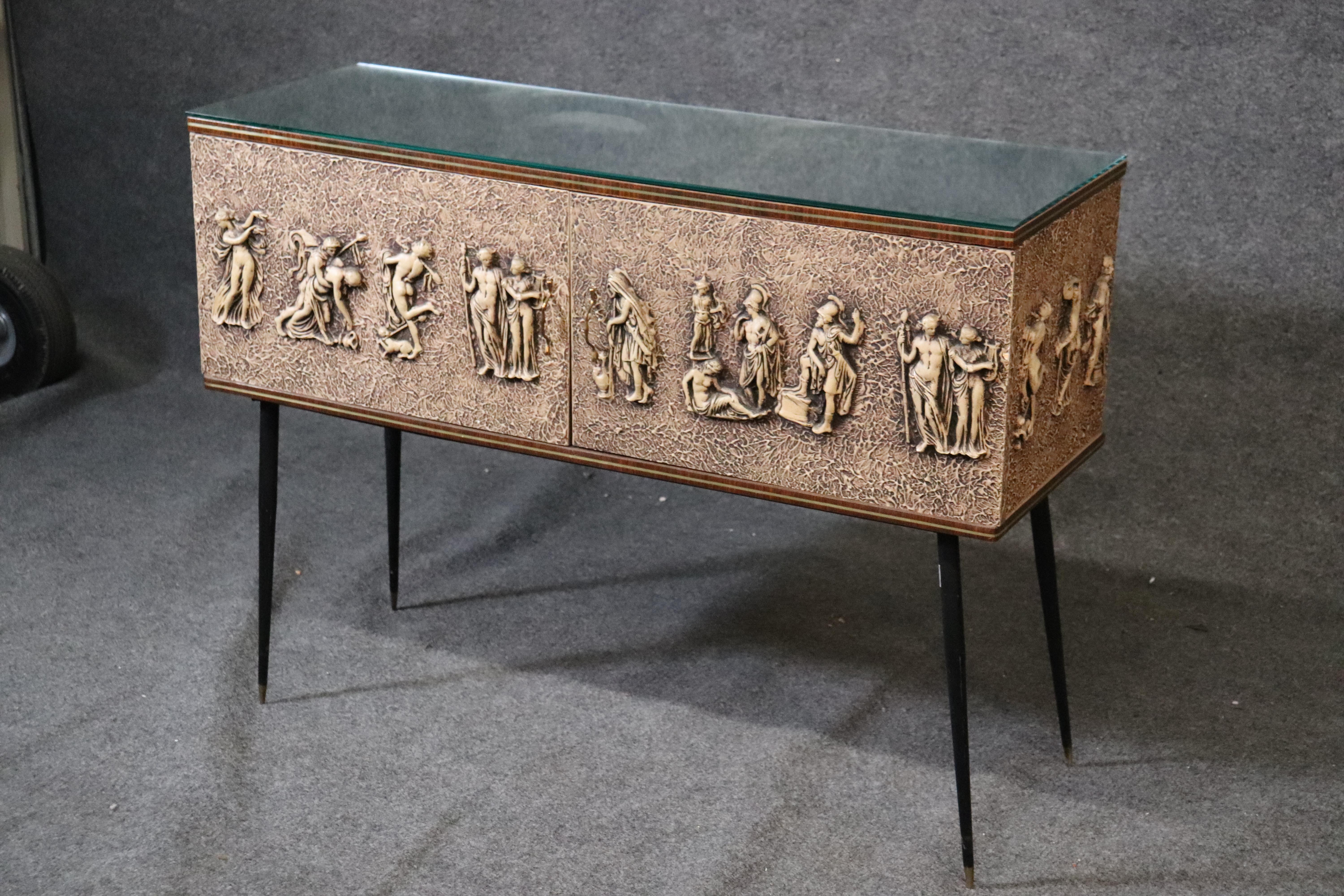 This is a beautiful Italian made figural cabinet that has storage and can function as a low console table. The table measures: 30 tall x 40 wide x 13 deep.