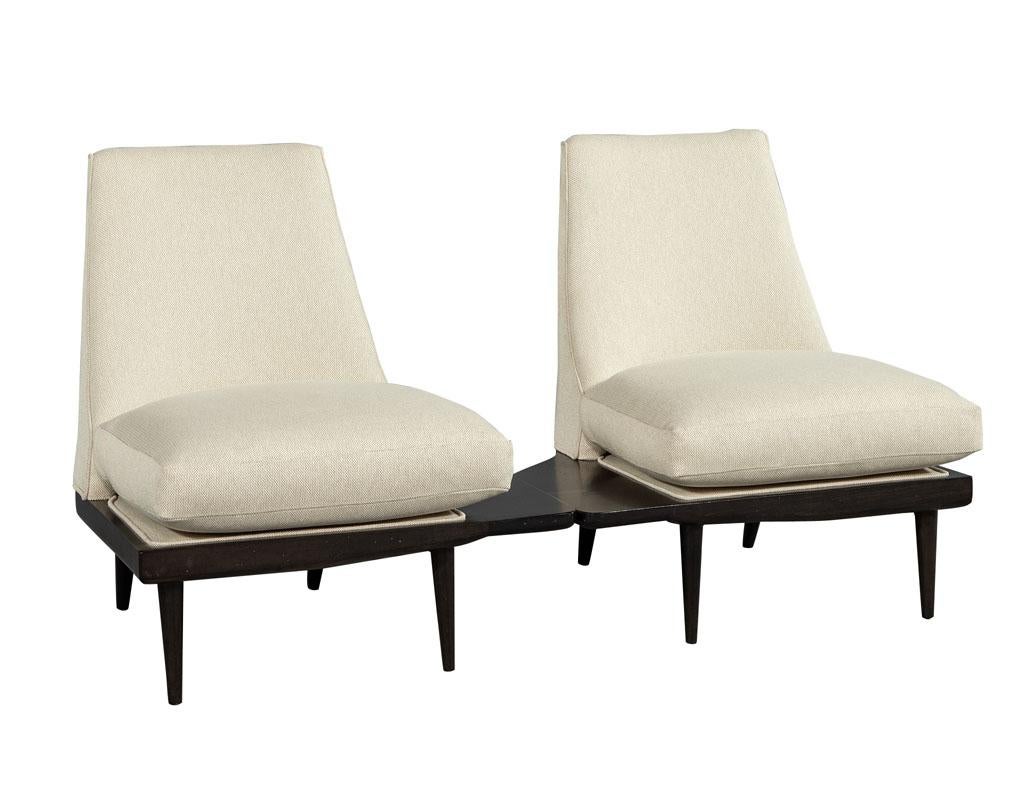 Unique Mid-Century Modern parlor drinking lounge chairs. Unique and original drink lounge parlor chairs. Composed of a solid distressed wood frame and newly upholstered in a beige linen fabric. This pair of chairs are super rare and a one of a kind