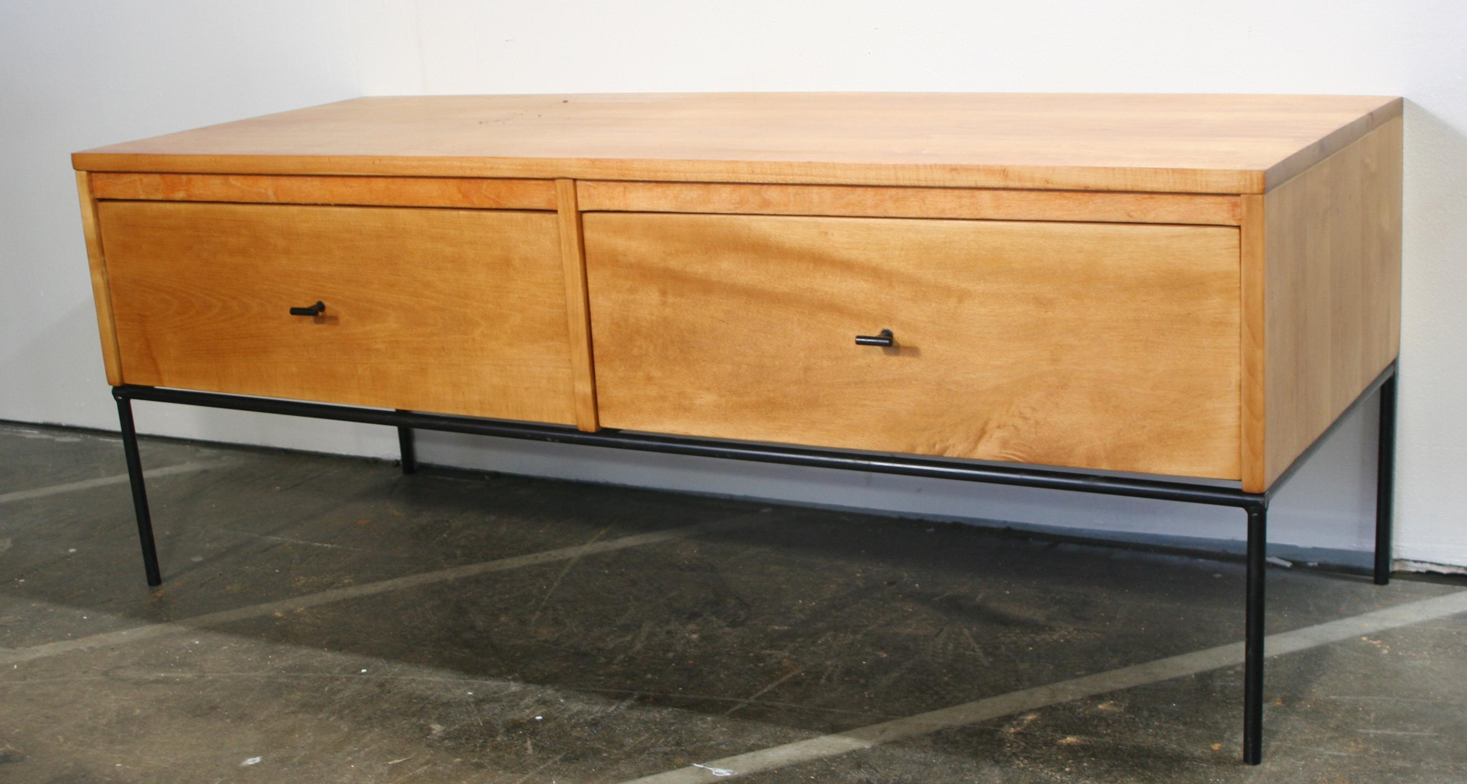 Unique rare custom midcentury low dresser small Credenza by Paul McCobb circa 1950 Planner Group with two low drawers - solid maple construction has a raw Blonce lacquered finish. All original Steel T pulls. Sits on an iron base with 4 legs.