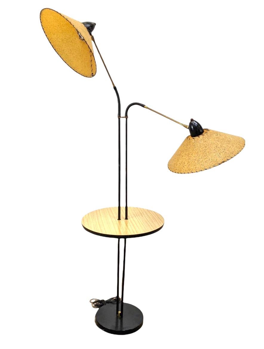 A lamp unlike any other we have encountered. Double shade gooseneck floor lamp with tray table. All original with shallow tapered fiberglass tapered conical shades. Shades pivot in endless combinations to cast light in any direction. 
 