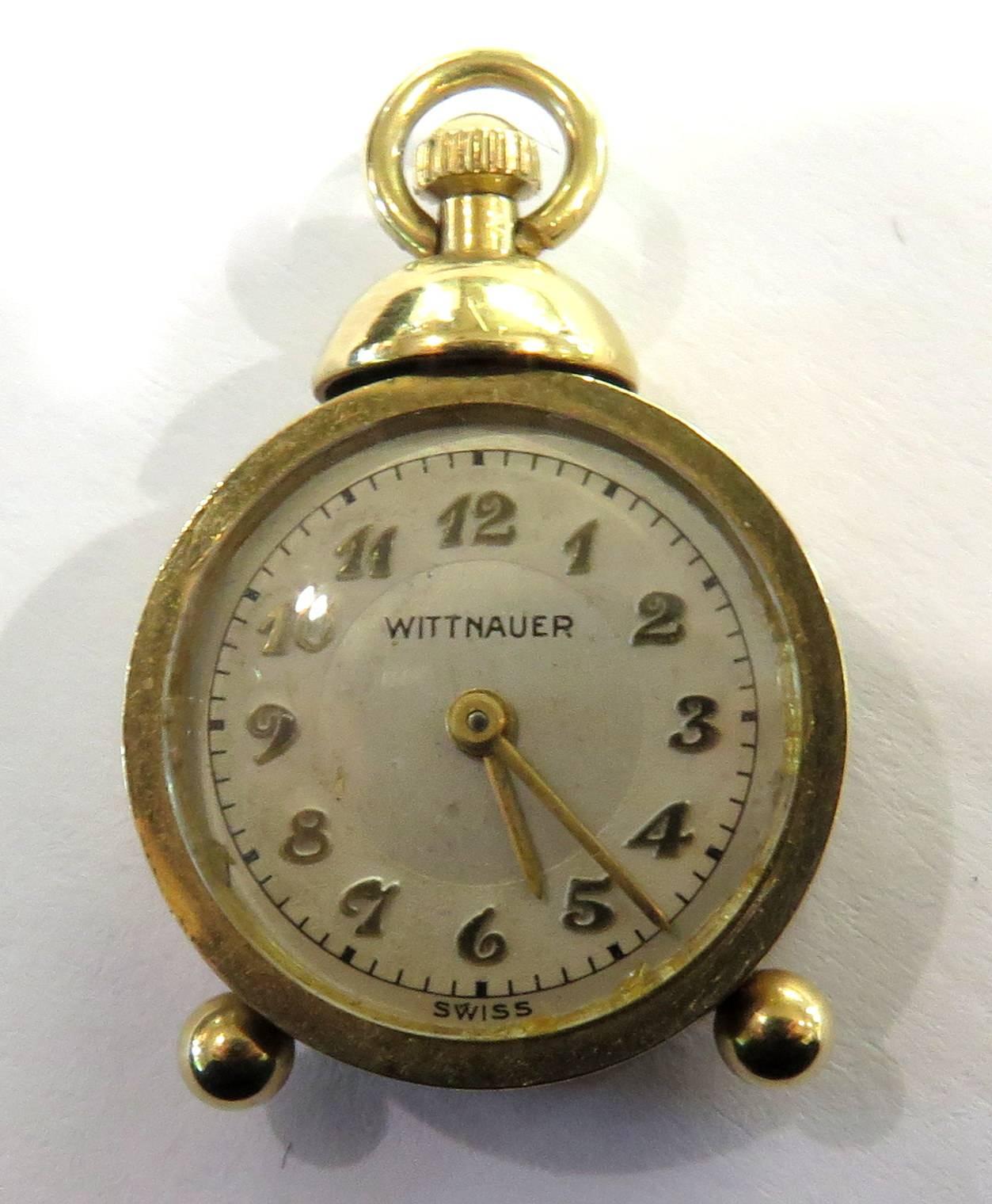 This fabulous 14k gold charm is an actual miniature Wittnauer clock that does not work. Actually, since I wound this mini clock, it IS working! No guarantee how long though. This charm pendant would be a great & unique addition to any charm bracelet