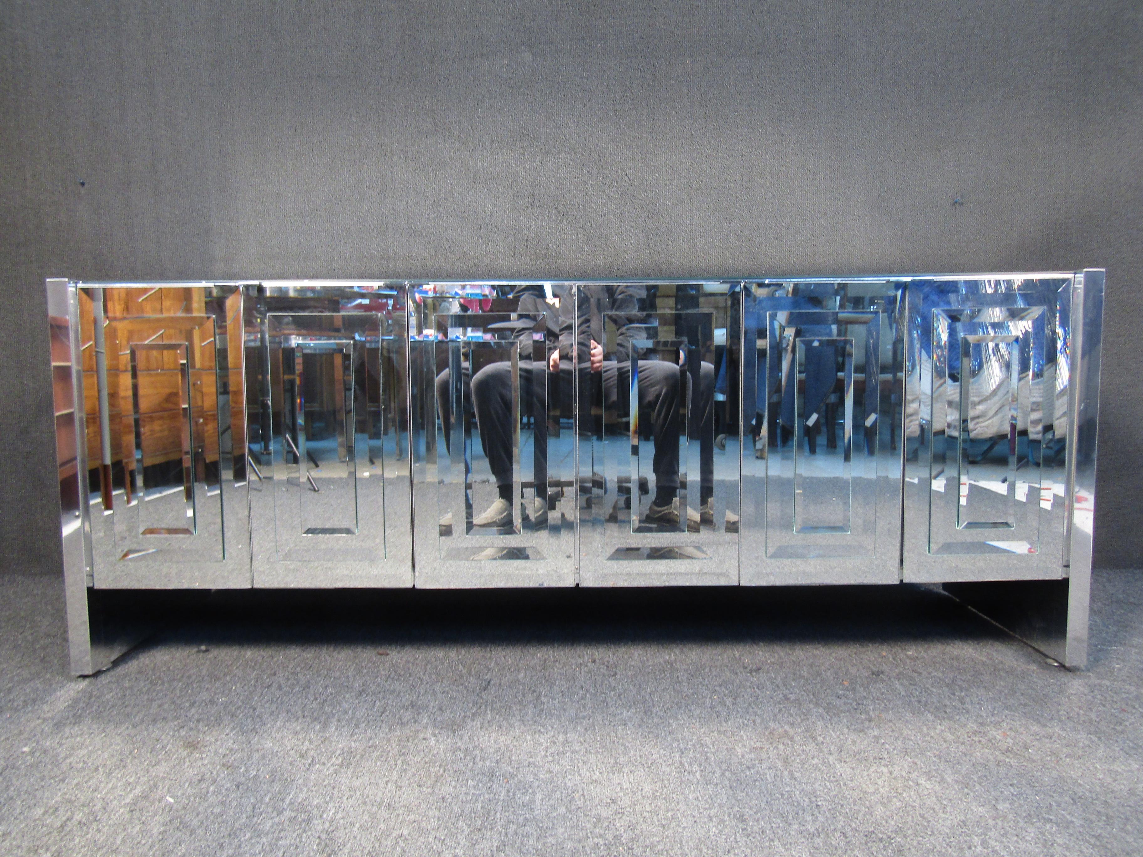 Stunning vintage credenza by Ello Furniture. The coveted six door Skyscraper design features stacked folding door panels. They have lots of great storage space and the side panels are chrome metal.
Please confirm item location (NY or NJ).
 