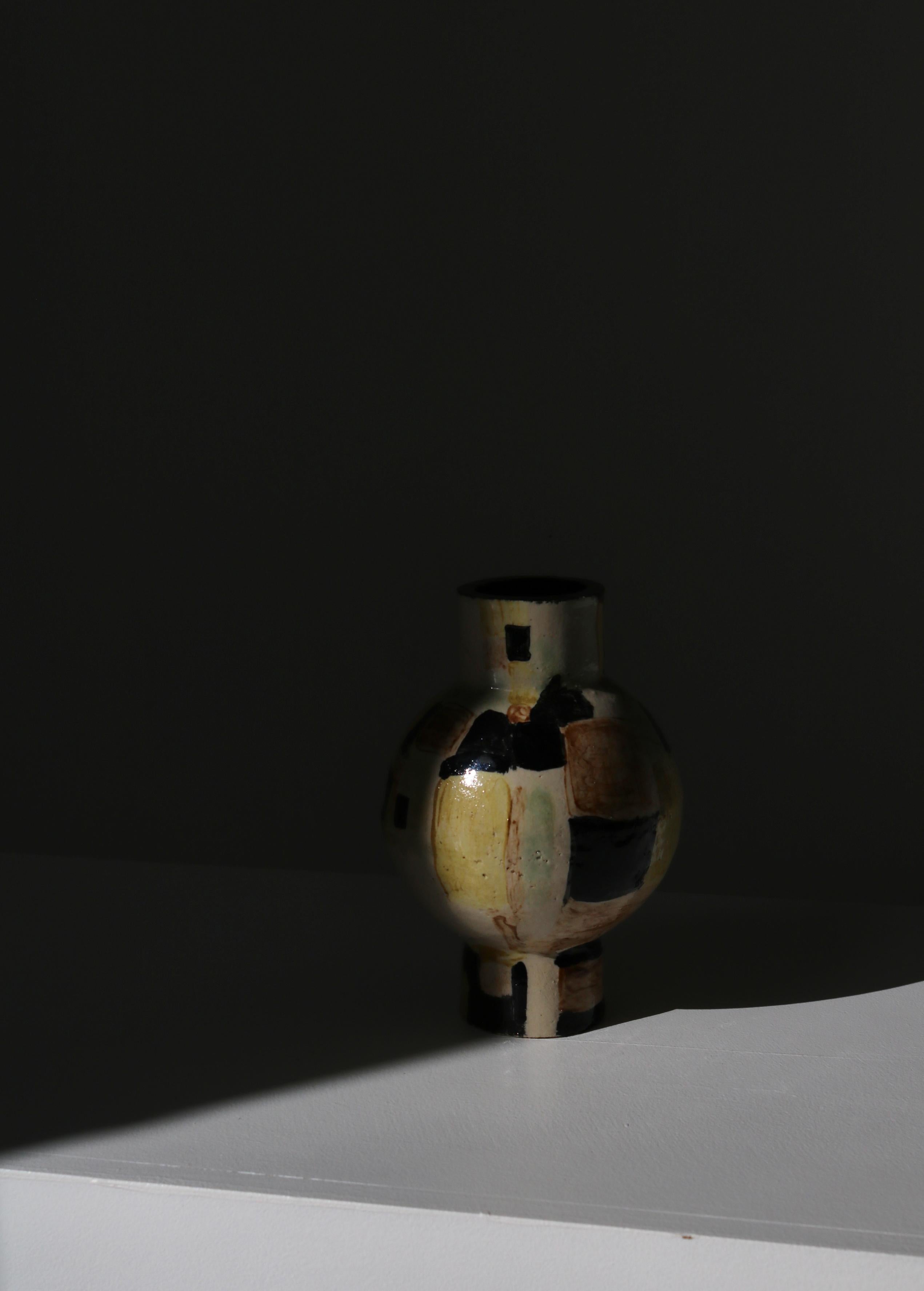 Unique sculptural vase by Danish artist Vilhelm Bjerke Petersen probably made at Rörstrand, Sweden in the 1950s. handmade in stoneware and decorated with abstract patterns. 
Vilhelm Bjerke-Petersen (December 24, 1909 - September 13, 1957) was an