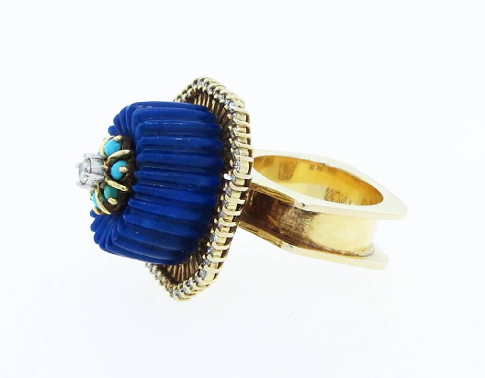 One of a kind dimensional 14kt. yellow gold fluted lapis lazuli set at the top with a cluster of turquoise with a center diamond. Made in the 1970's . The mount is surrounded with in a fan design with diamonds. Size 6 1/2 and can be sized.