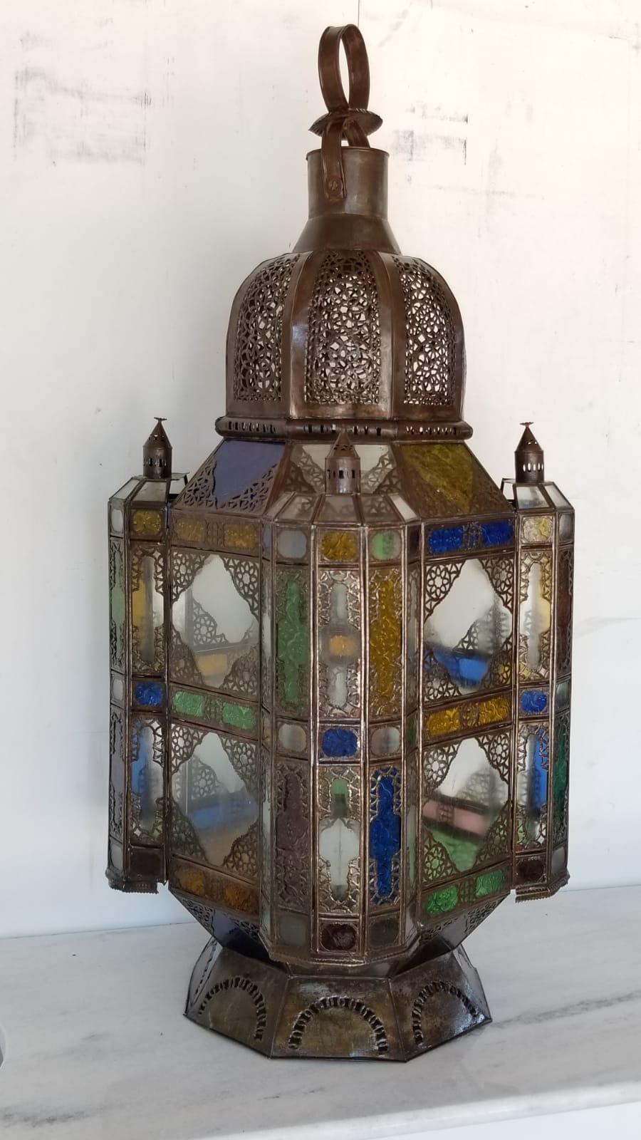 Unique and Large Moroccan rustic Lantern or chandelier. Great workmanship, all handmade. A great piece for indoor or outdoor .The lantern come with frosted glass and multi-color Moorish glass amber, blue and green.